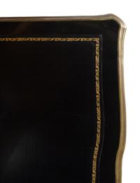 A Louis XV Style Gilt Metal Mounted Ebonized Bureau Plat