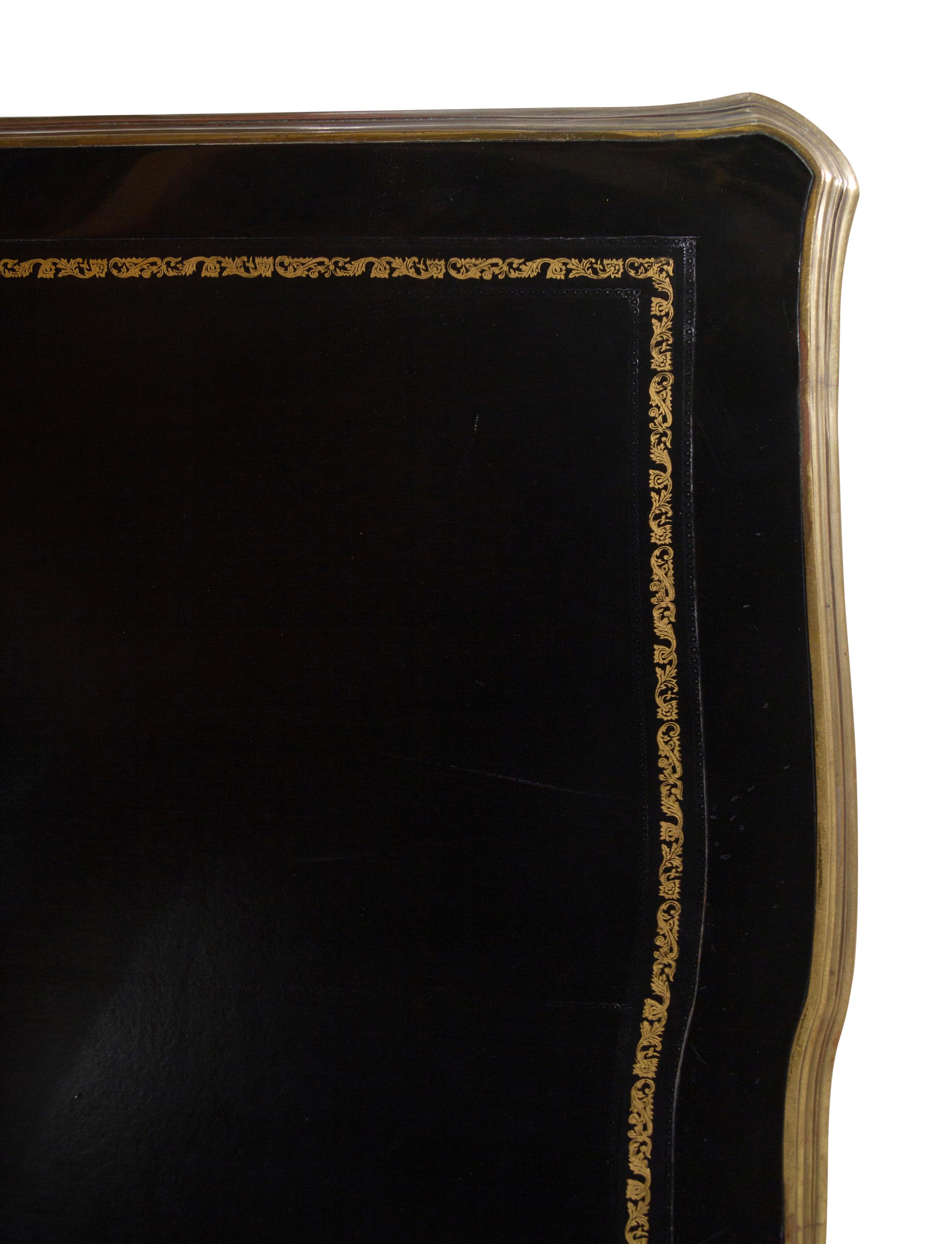 A Louis XV Style Gilt Metal Mounted Ebonized Bureau Plat