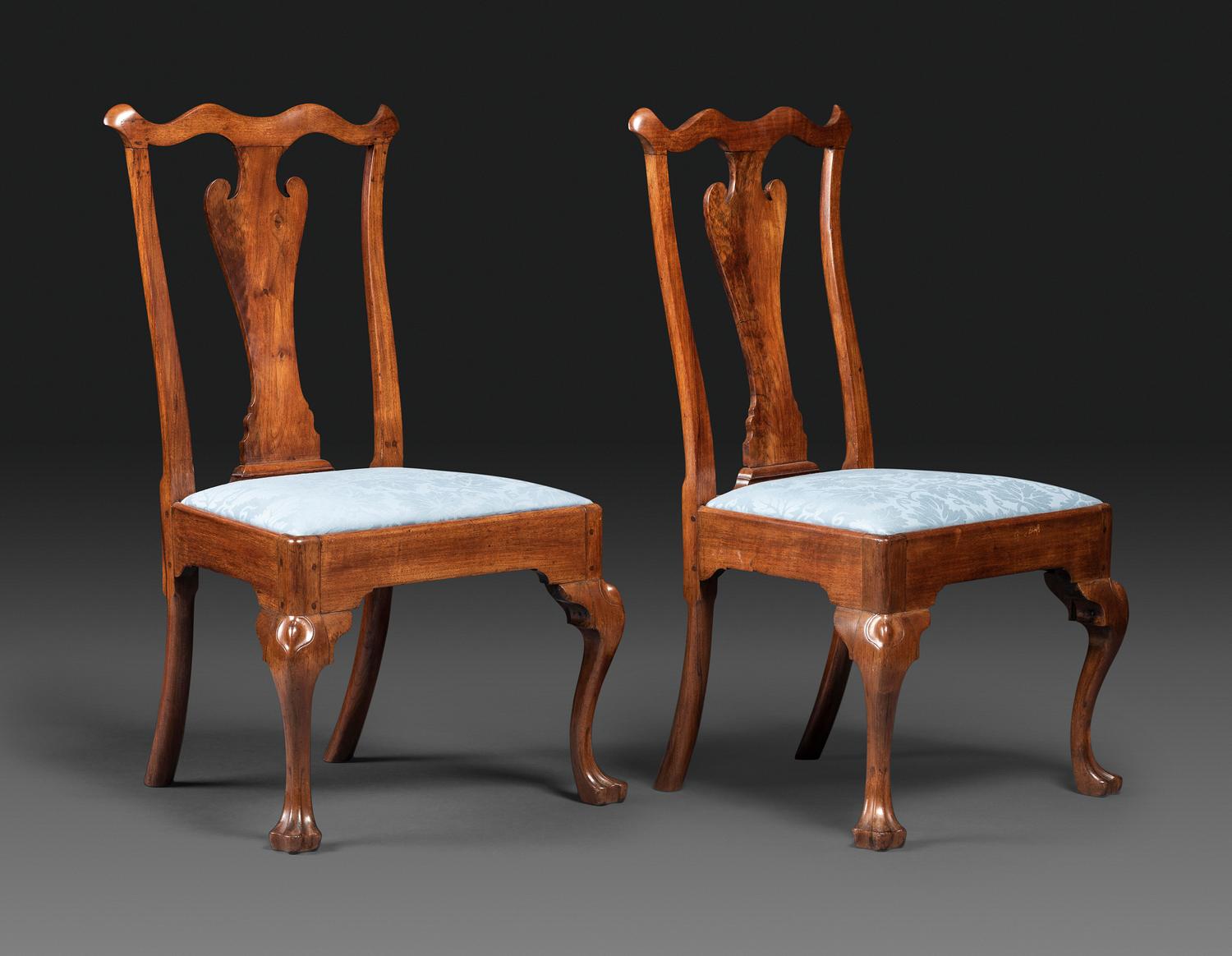 A Pair of Queen Anne Carved Walnut Trifid Foot Side Chairs