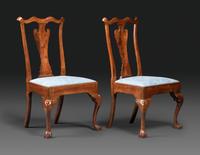 A Pair of Queen Anne Carved Walnut Trifid Foot Side Chairs