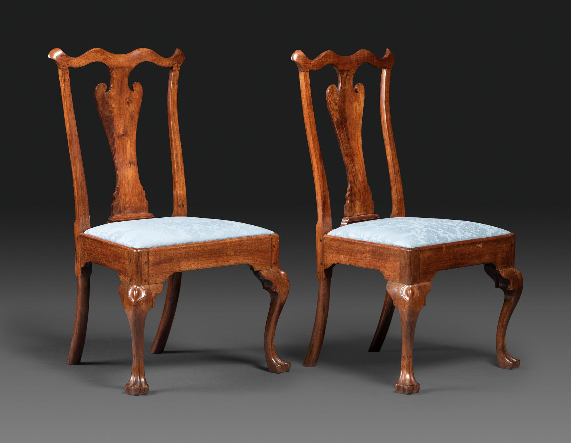 A Pair of Queen Anne Carved Walnut Trifid Foot Side Chairs