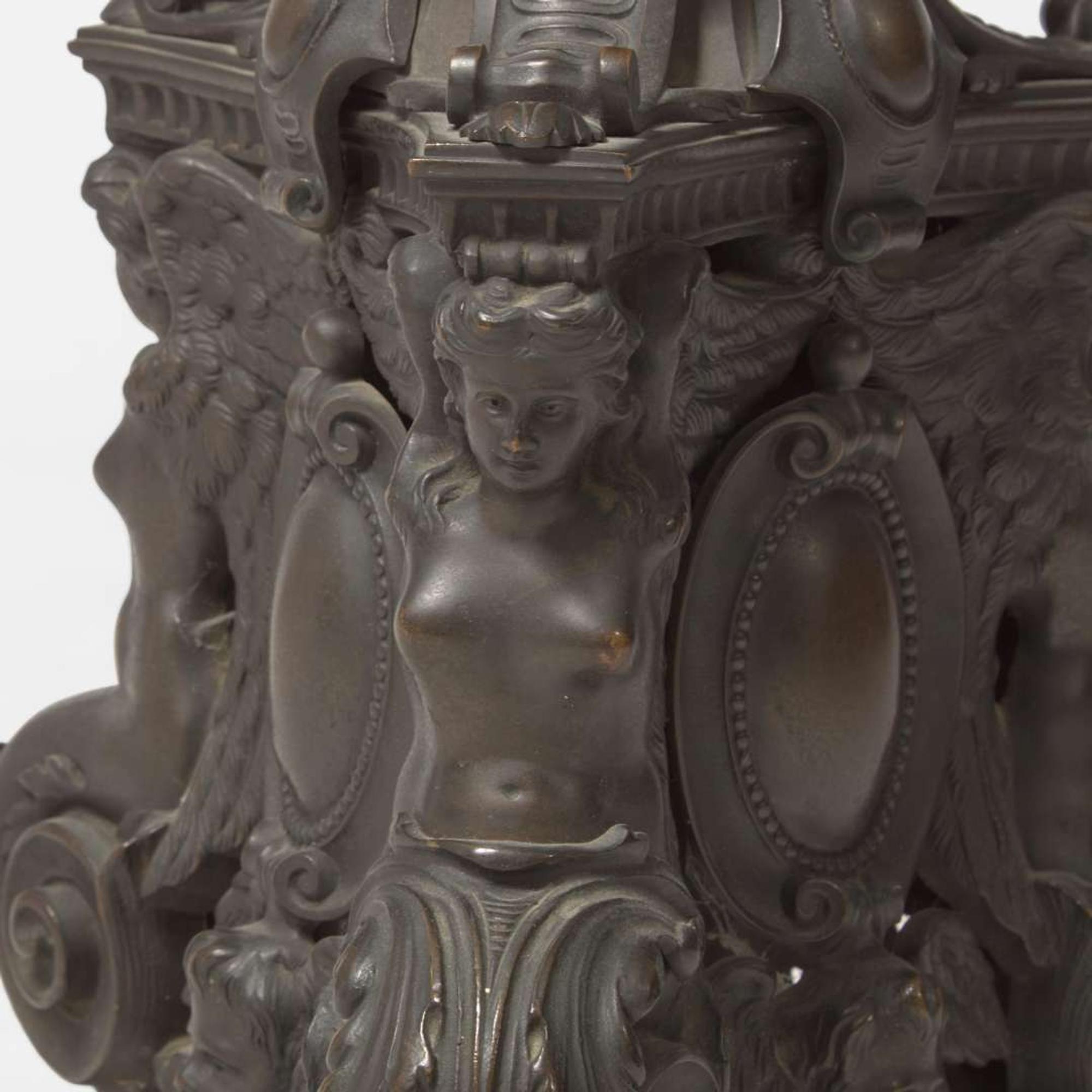 A pair of Renaissance Revival patinated bronze andirons 19th century