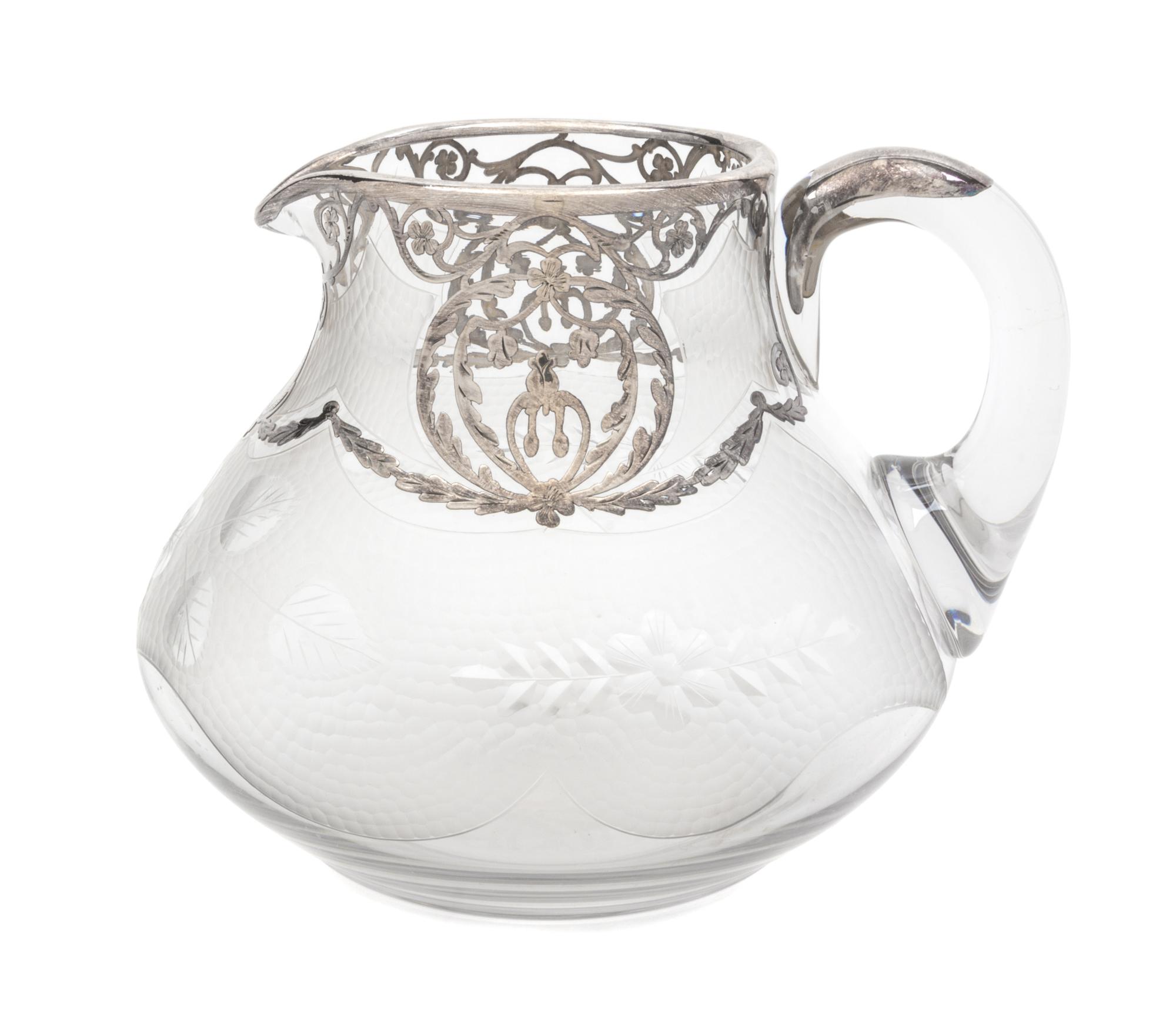 A Sterling Overlay Clear and Wheel Cut Pitcher Height 6 inches.