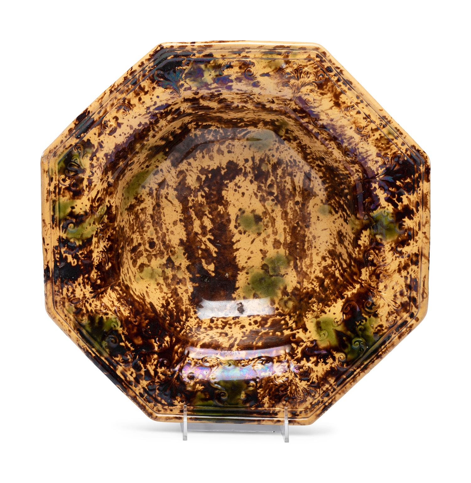 A Large Molded Yellowware Bowl with Flint Enamel Glaze