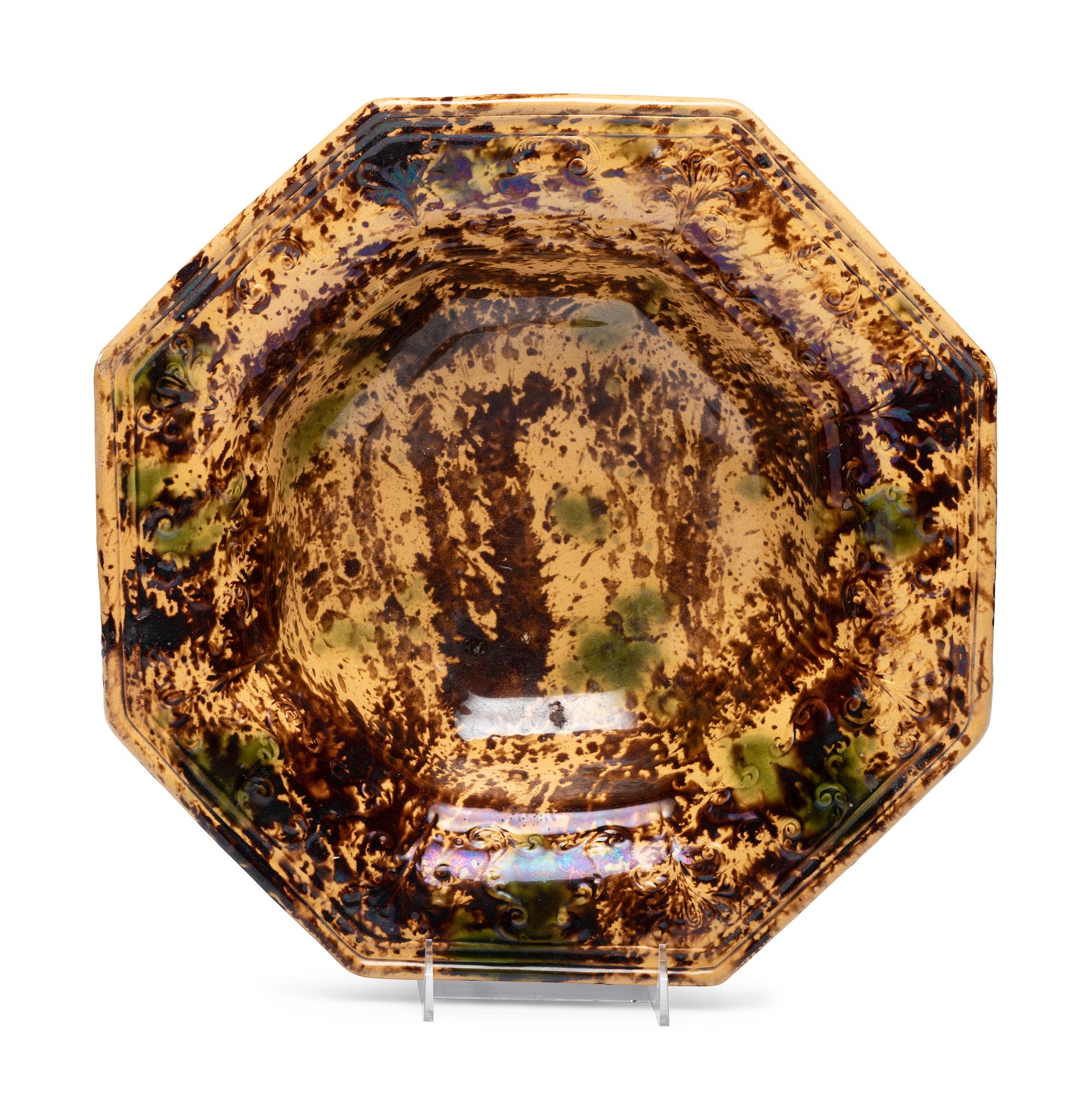 A Large Molded Yellowware Bowl with Flint Enamel Glaze