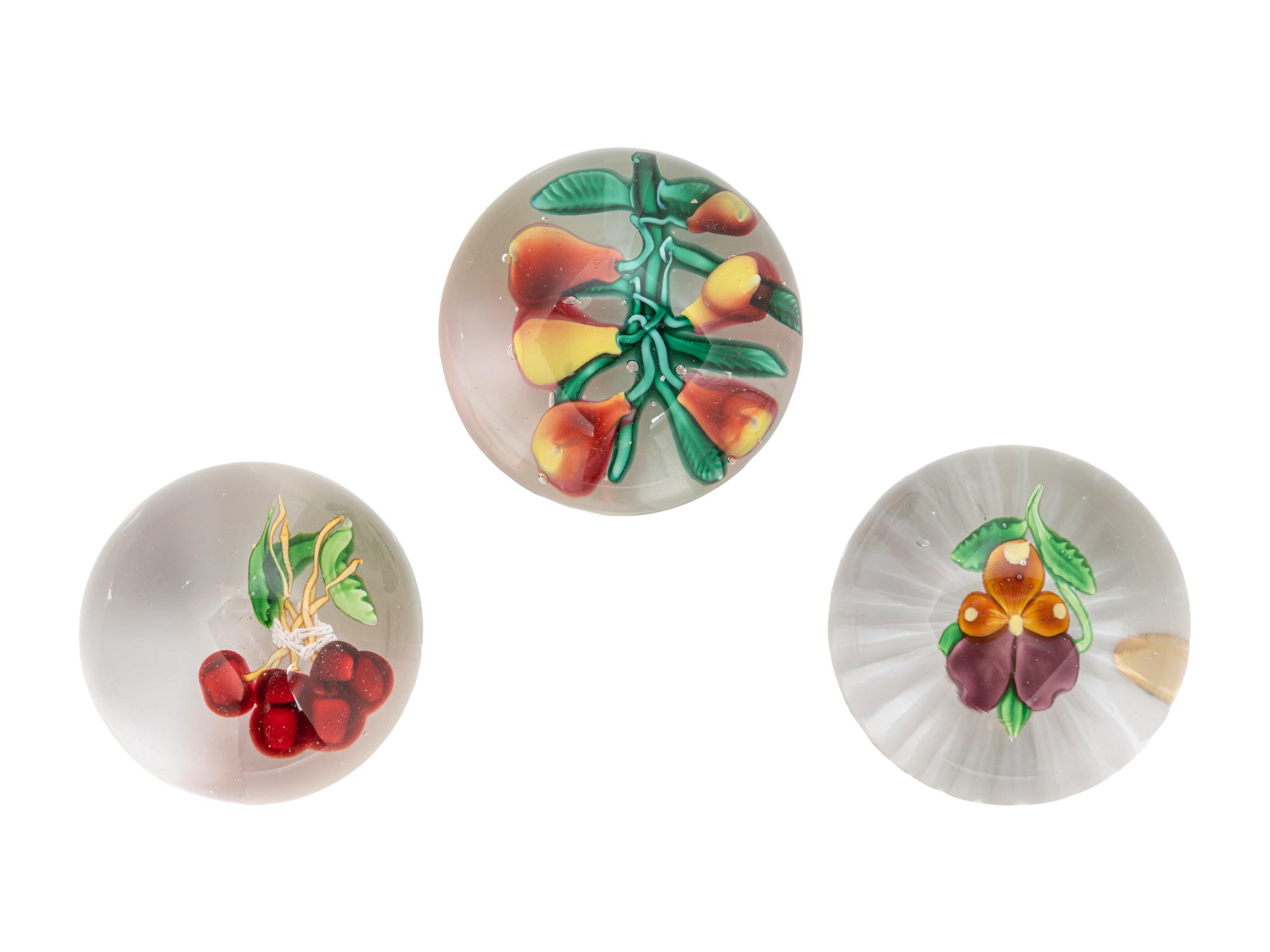 A Five Pears Glass Paperweight, a Bundle of Cherries Glass Paperweight and a Pansy Glass Paperweight
