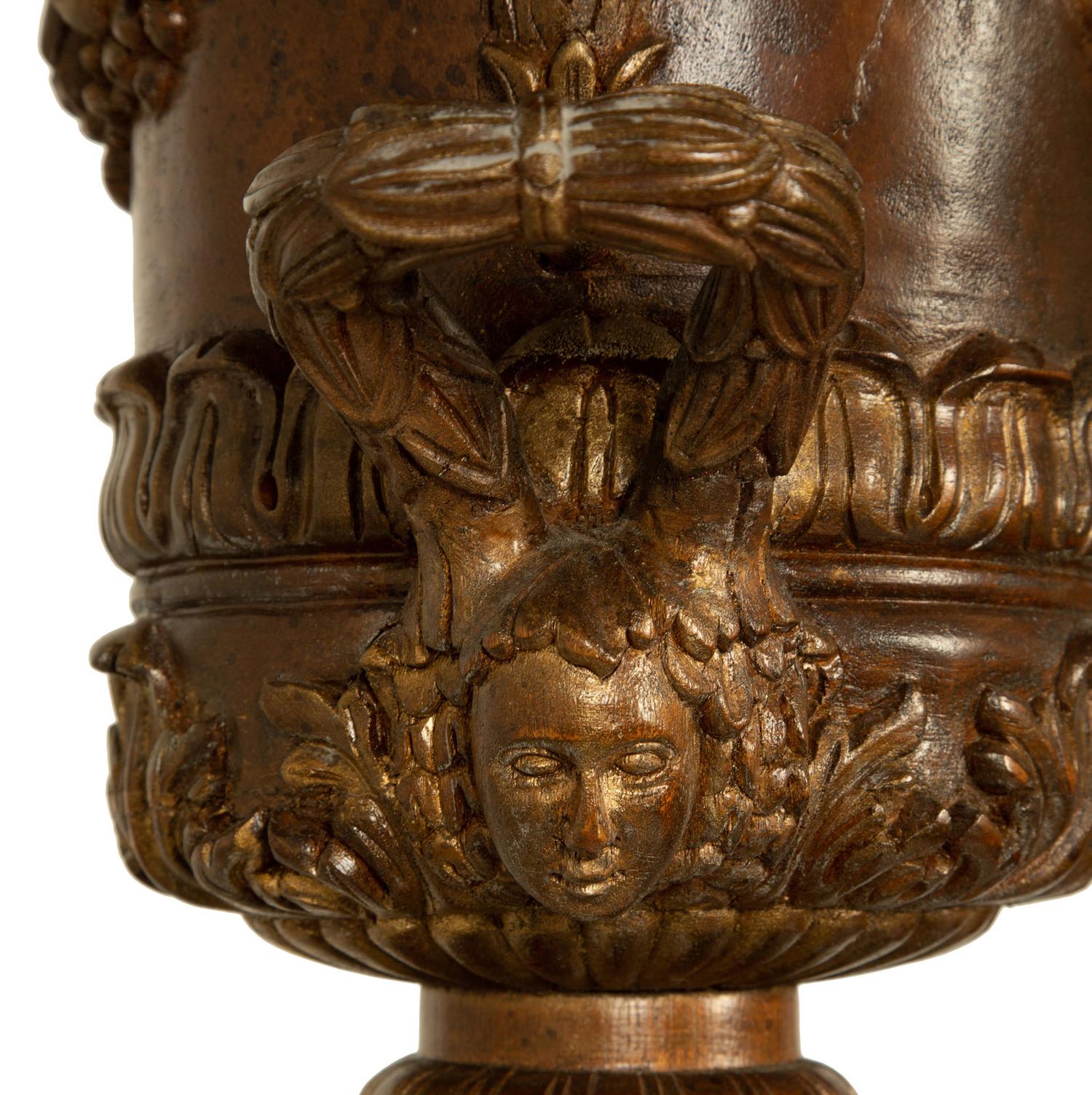 A Pair of George III Style Carved and Stained Wood Campana Urns on Pedestal Stands — 20TH CENTURY