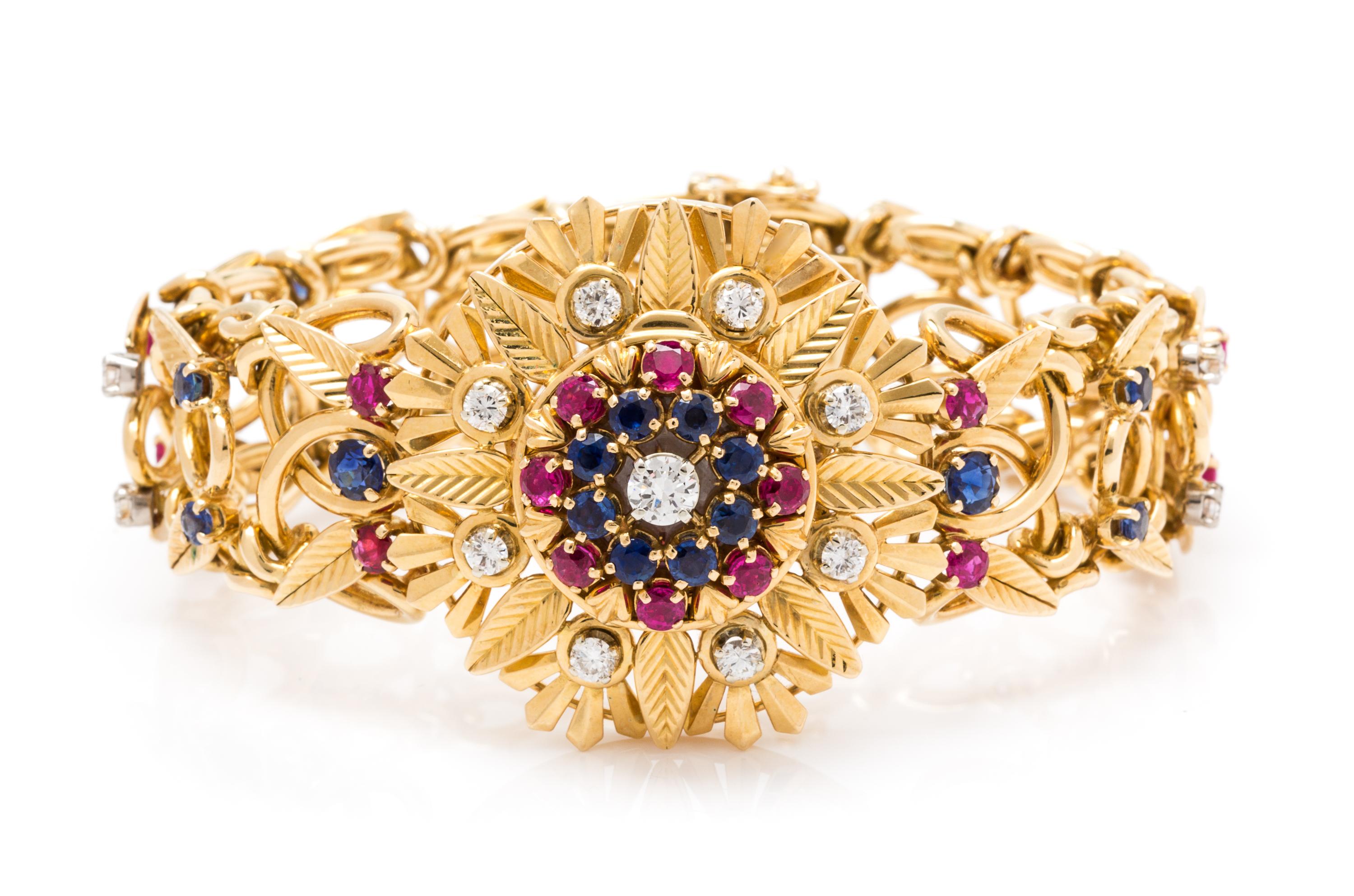 An 18 Karat Yellow Gold Diamond, Ruby and Sapphire Surprise Watch Bracelet, 60.30 dwts.