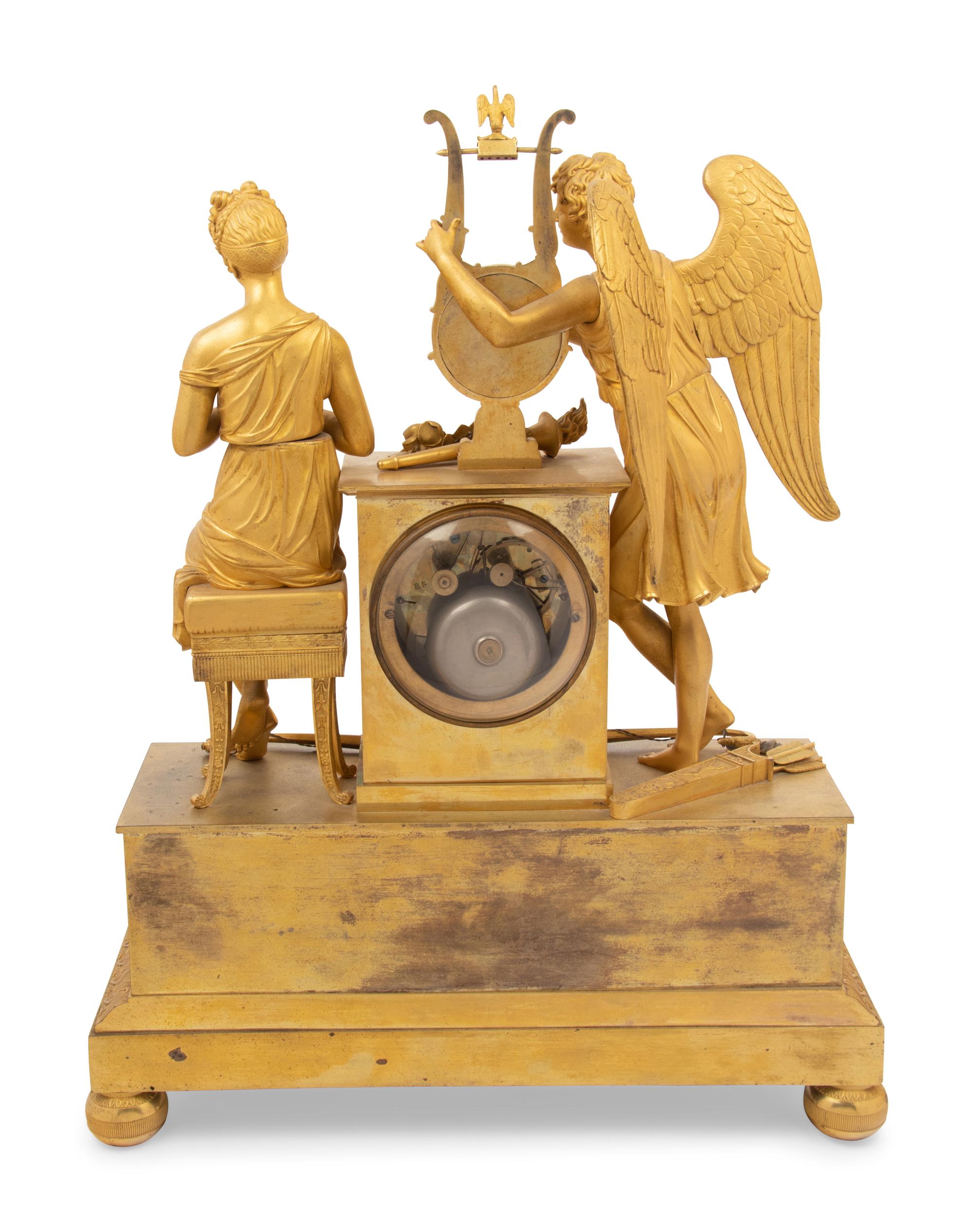 An Empire Gilt Bronze Figural Mantel Clock