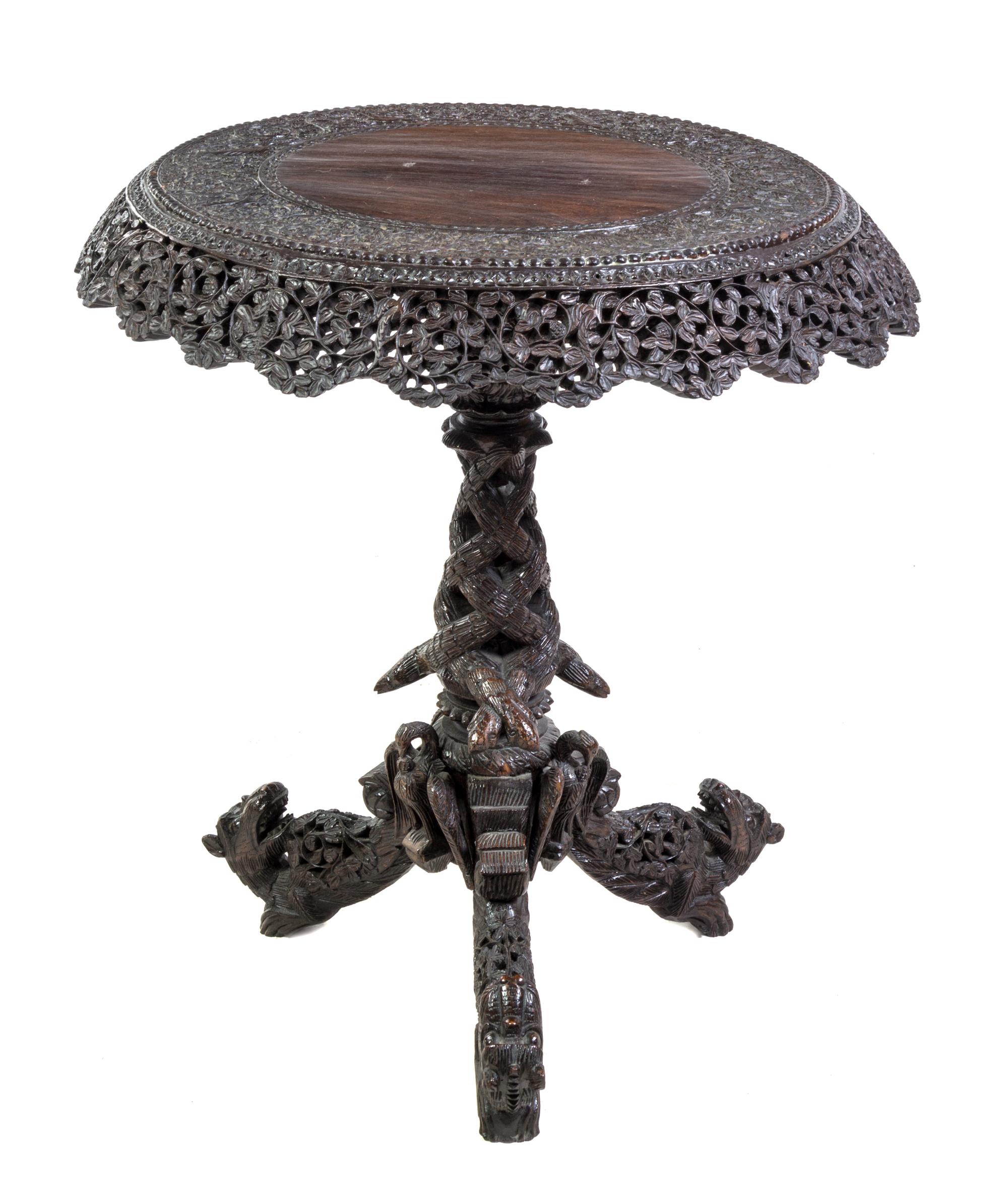 An Anglo-Indian Carved Hardwood Tilt-Top Table Height 30 3/4 x diameter 28 1/4 inches. — LATE 19TH/EARLY 20TH CENTURY
