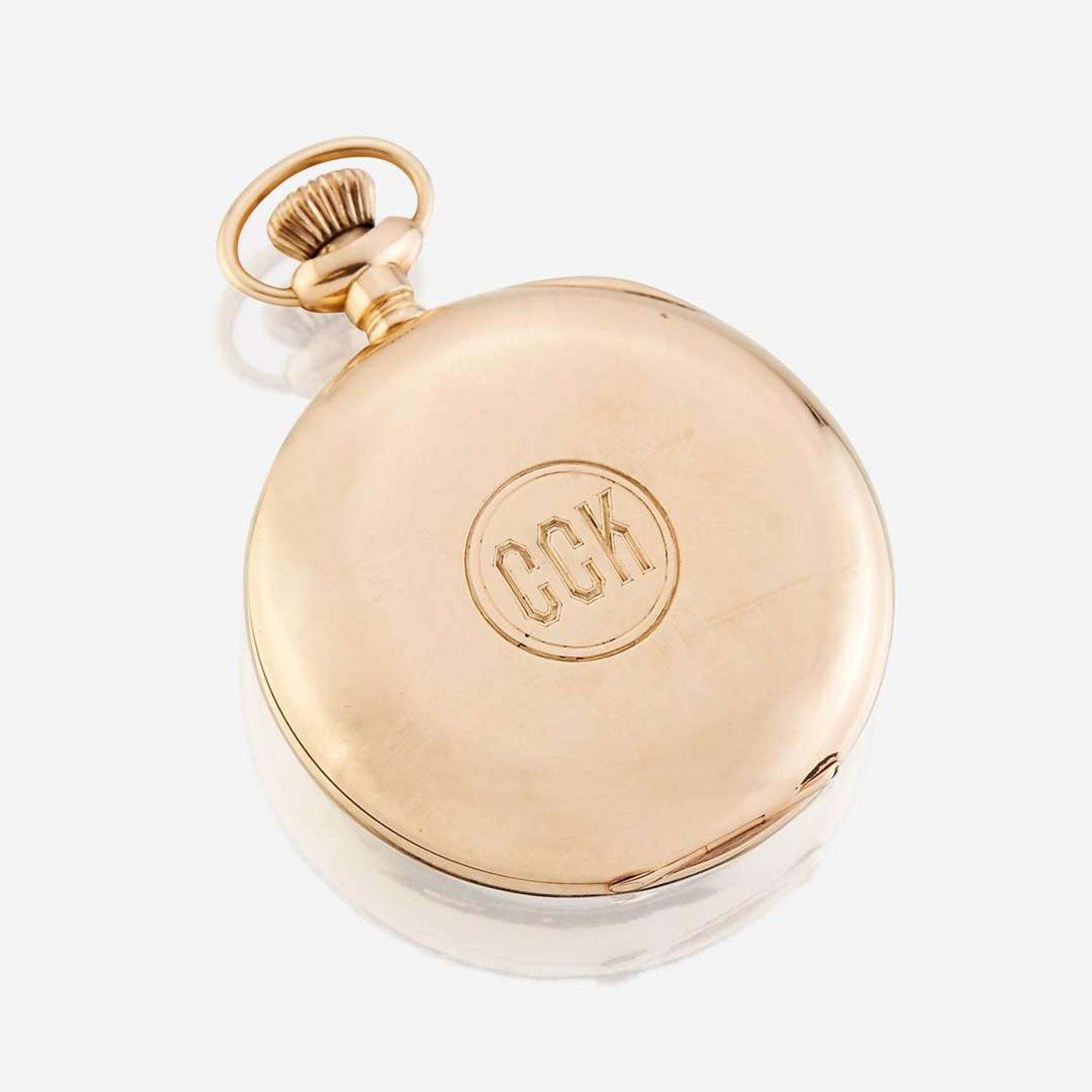 A fourteen karat gold open face pocket watch, Waltham, retailed by J.E. Caldwell