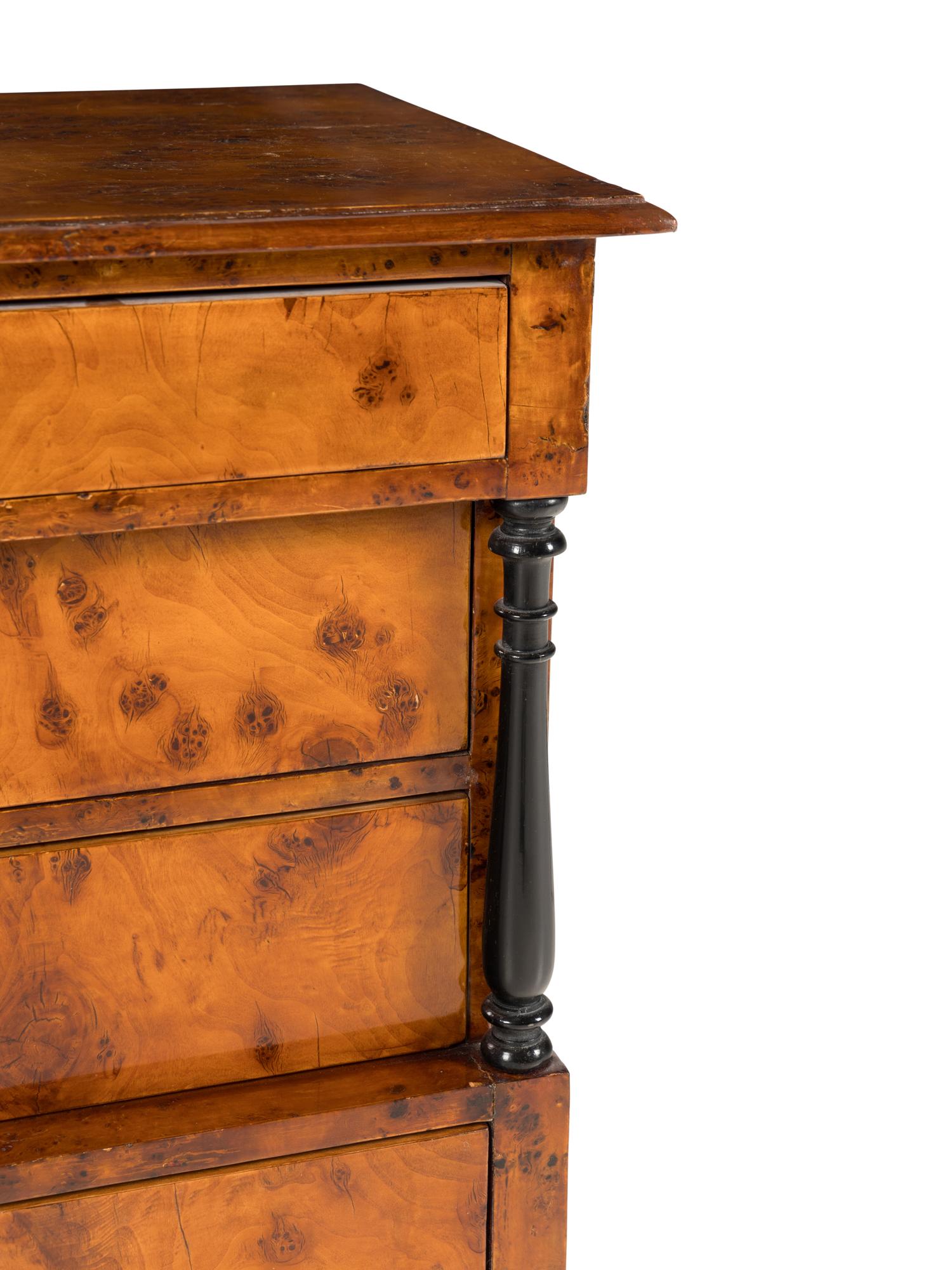 A Biedermeier Part-Ebonized Burlwood Commode