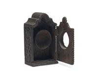 A Continental Carved Walnut Watch Hutch