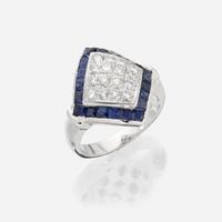 An eighteen karat white gold, diamond, and sapphire ring