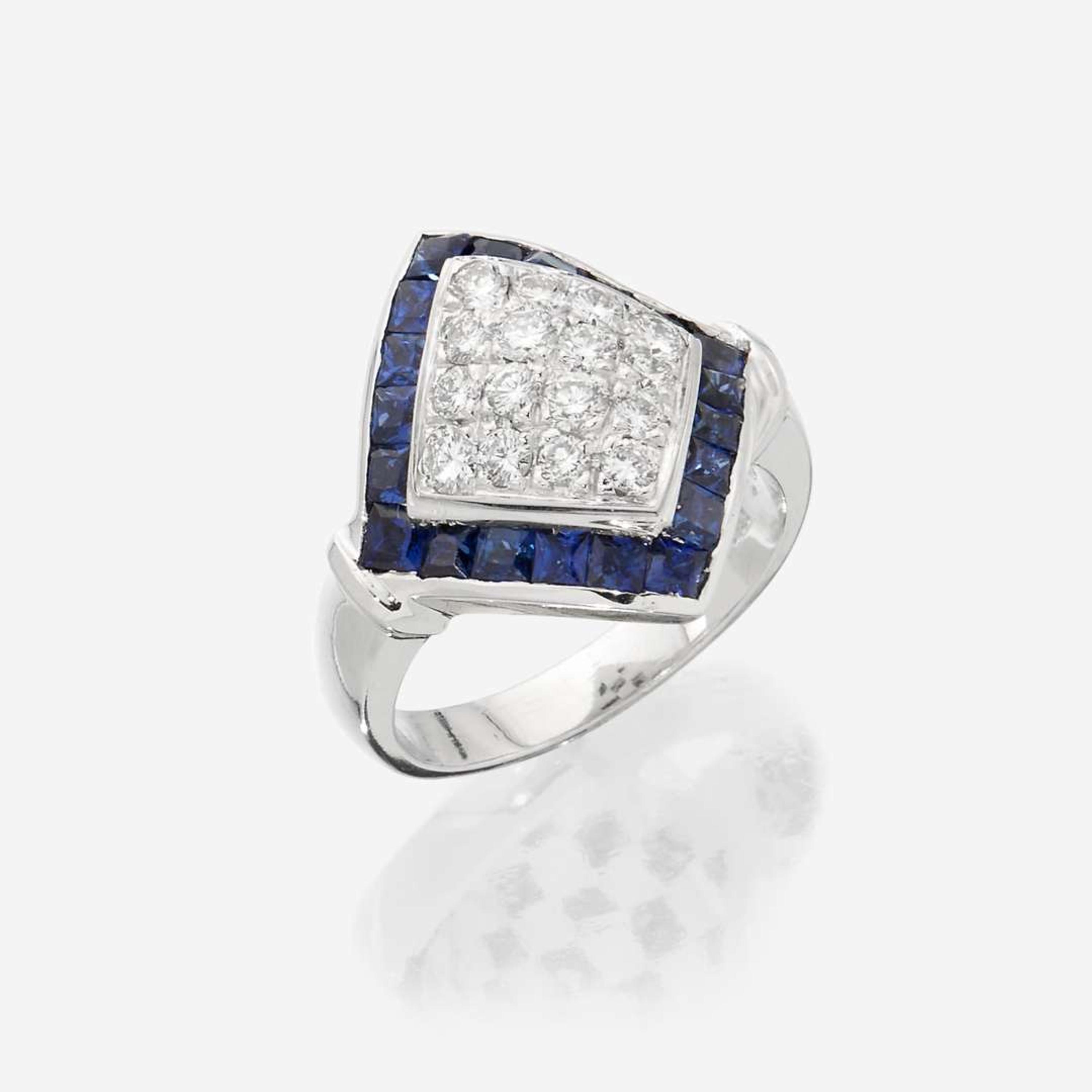 An eighteen karat white gold, diamond, and sapphire ring