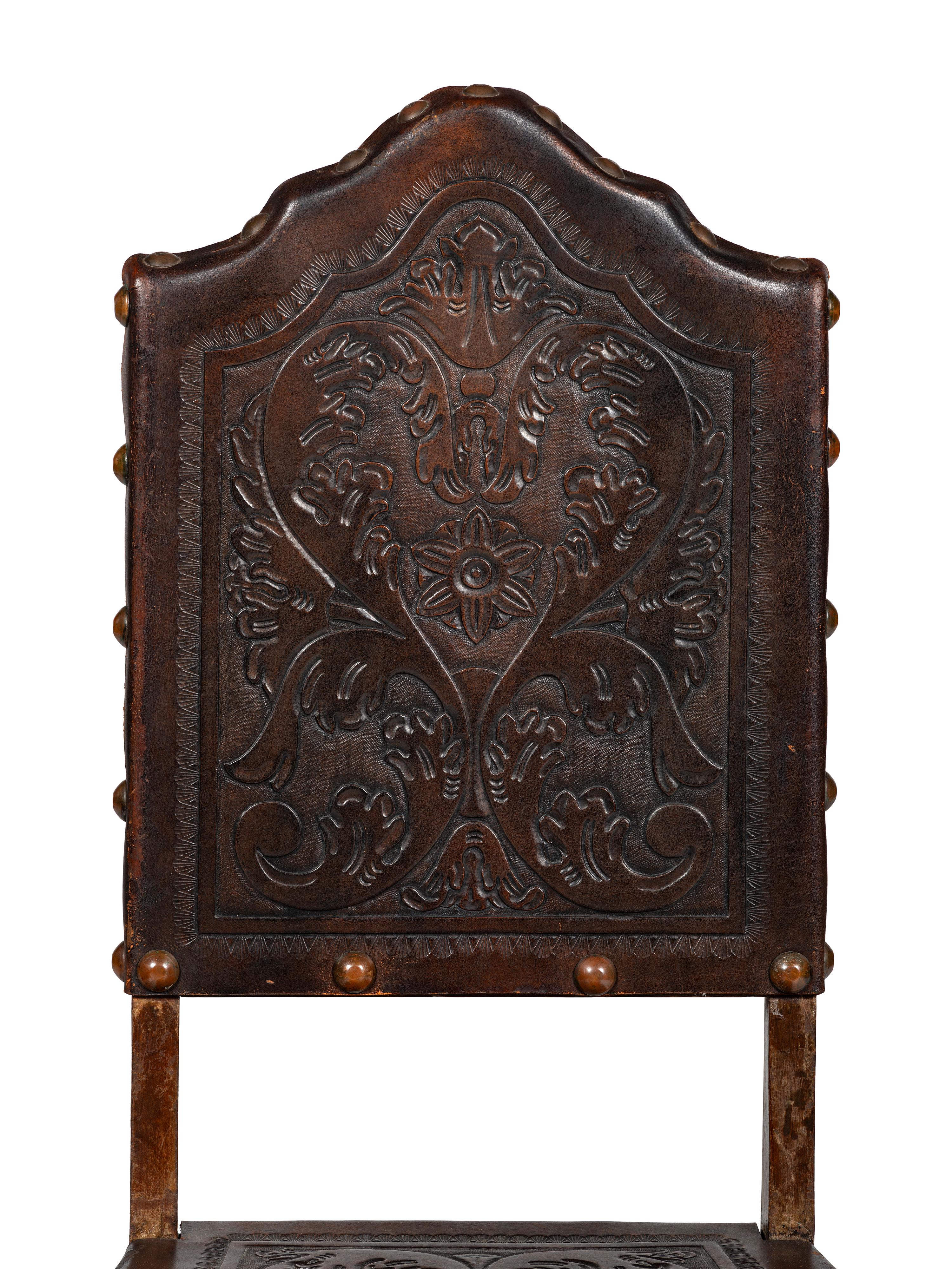 Six Mizner Carved Walnut and Embossed Leather Back Side Chairs