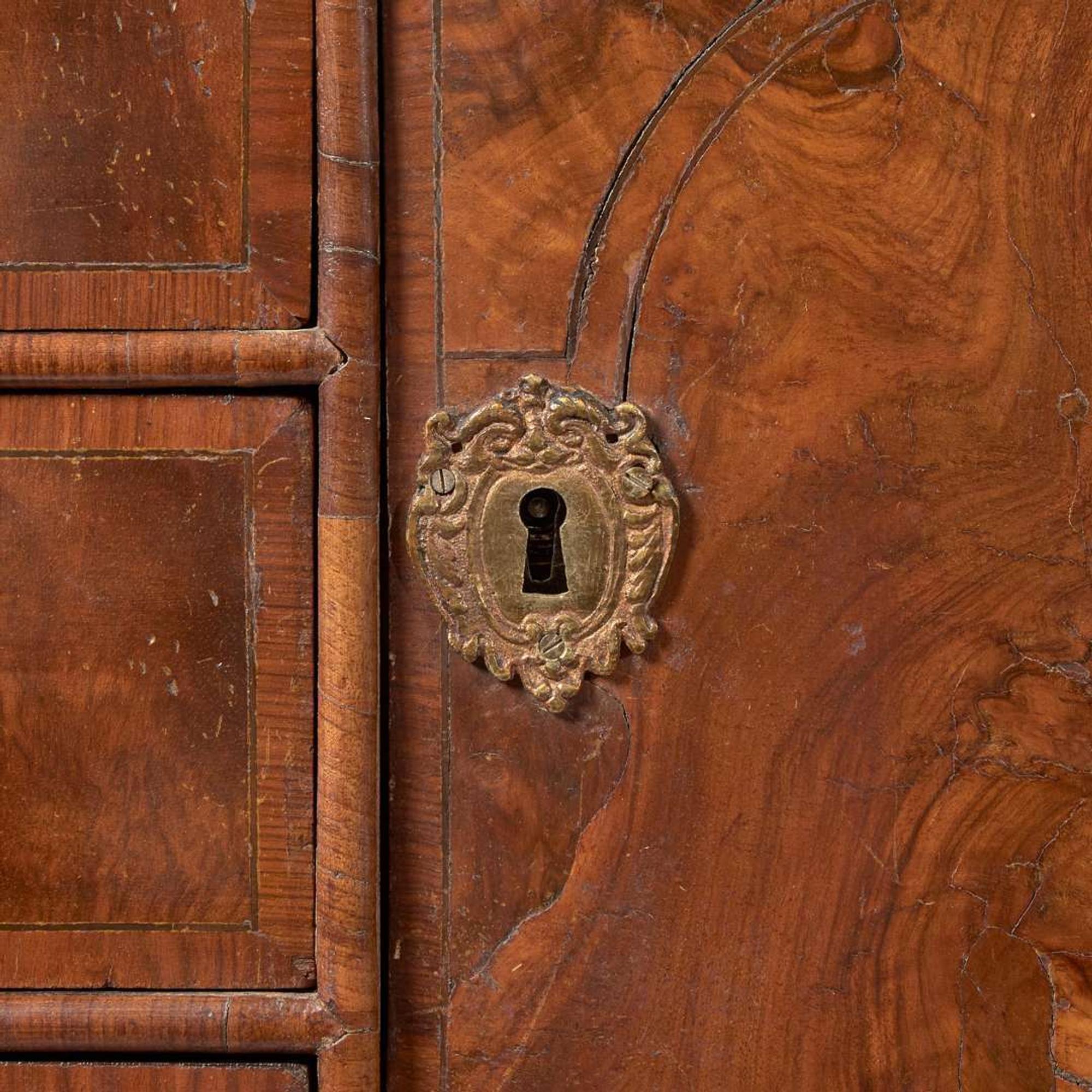 A William & Mary oyster veneered walnut secretary bookcase circa 1700