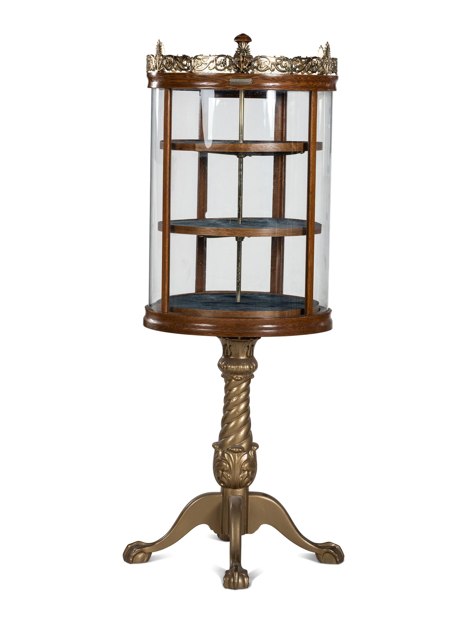A Gilt Metal Mounted Oak Crystal Case Co. Revolving Display Case