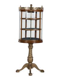 A Gilt Metal Mounted Oak Crystal Case Co. Revolving Display Case