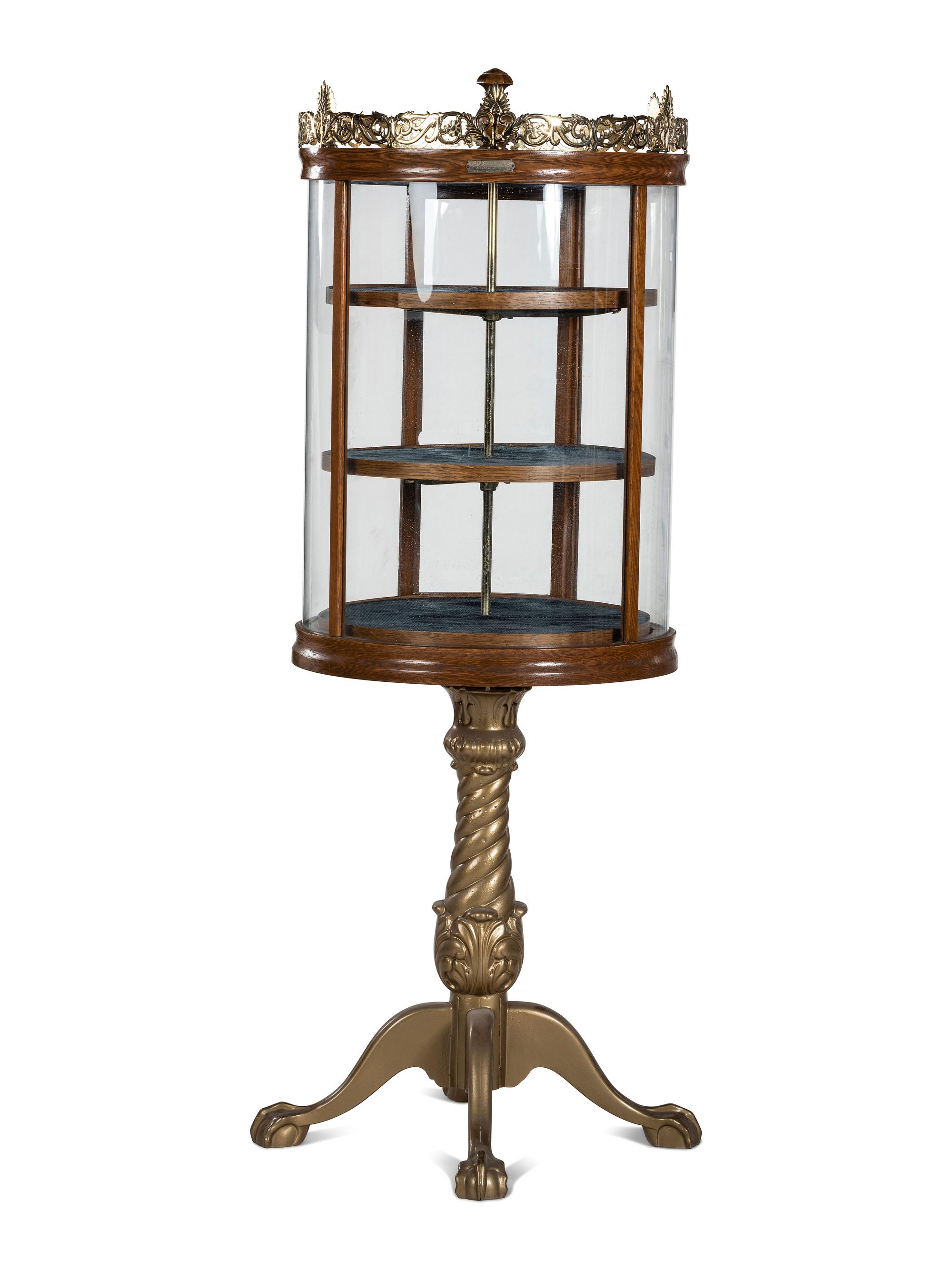 A Gilt Metal Mounted Oak Crystal Case Co. Revolving Display Case