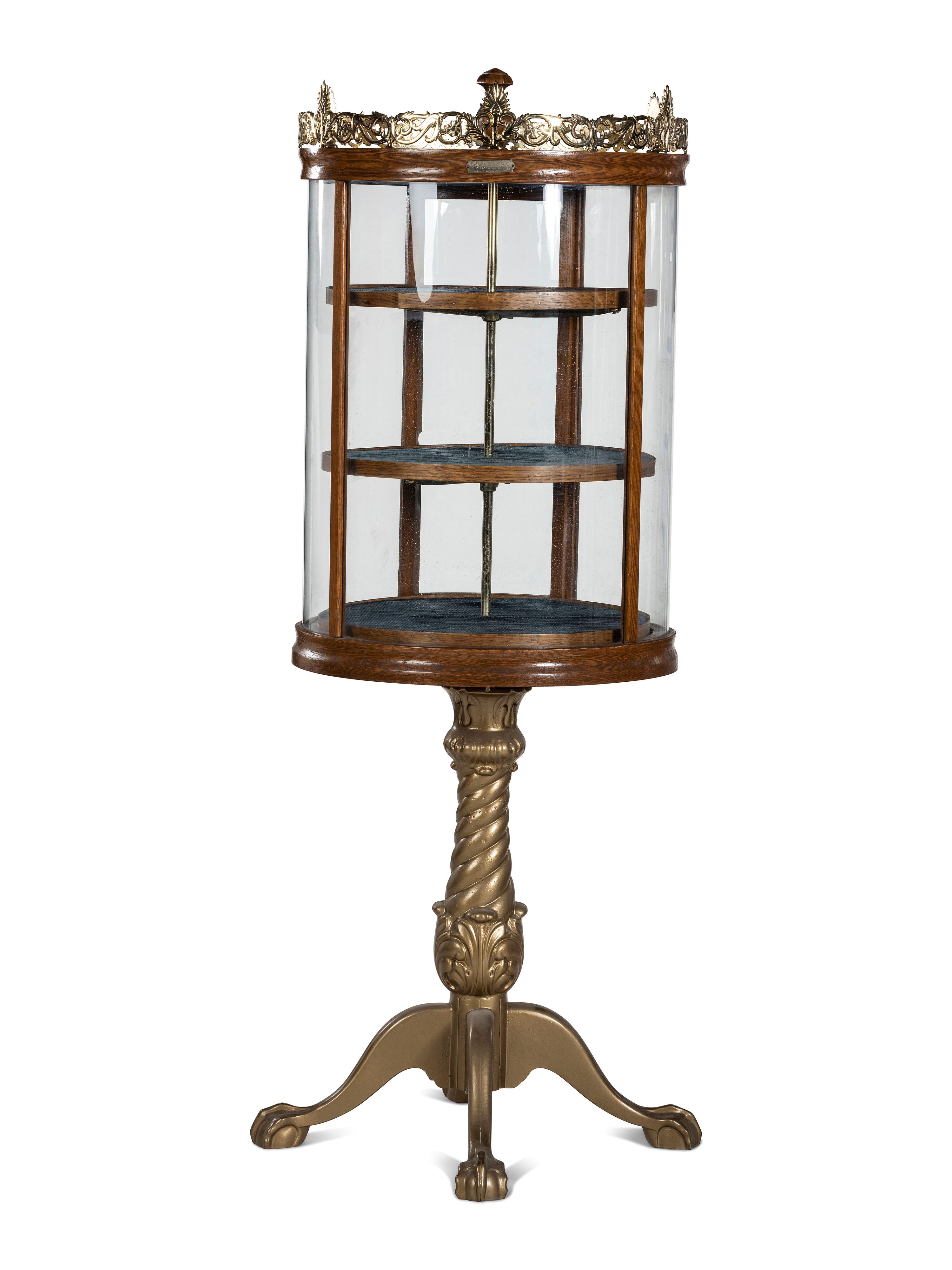 A Gilt Metal Mounted Oak Crystal Case Co. Revolving Display Case