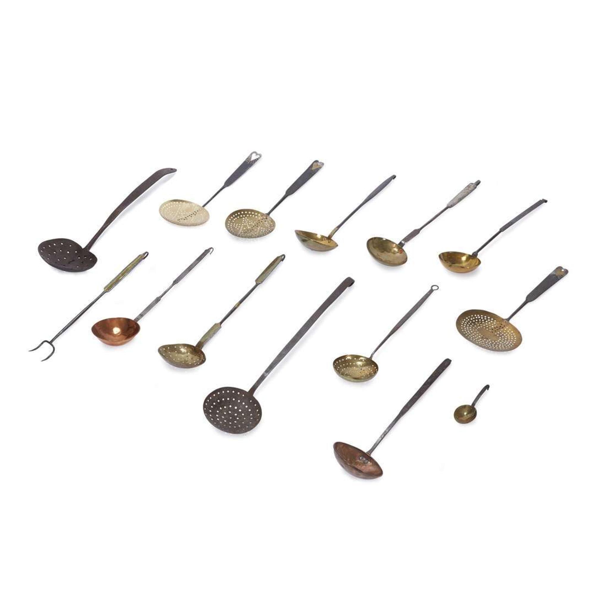 Large group of thirty-four iron, wood, brass, and copper lighting devices and cooking implements 18th/19th century