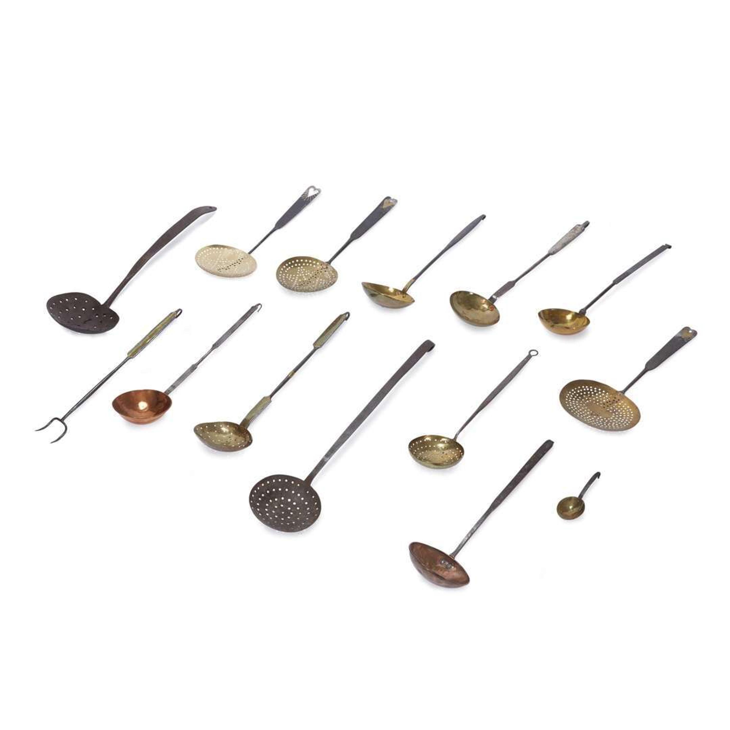Large group of thirty-four iron, wood, brass, and copper lighting devices and cooking implements 18th/19th century