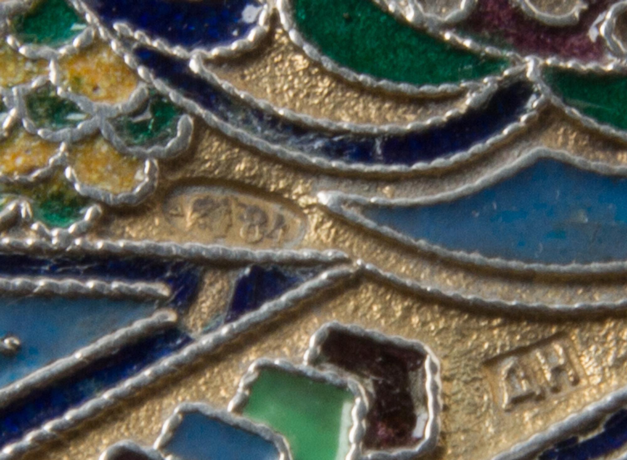 A Russian Silver and Enamel Cigarette Case, Mark of D. Nikolayev, Moscow, the case having a gilt wash ground with foliate and geometric