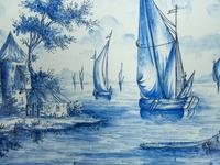 A Delft Ceramic Oval Cartouche Form Landscape Plaque