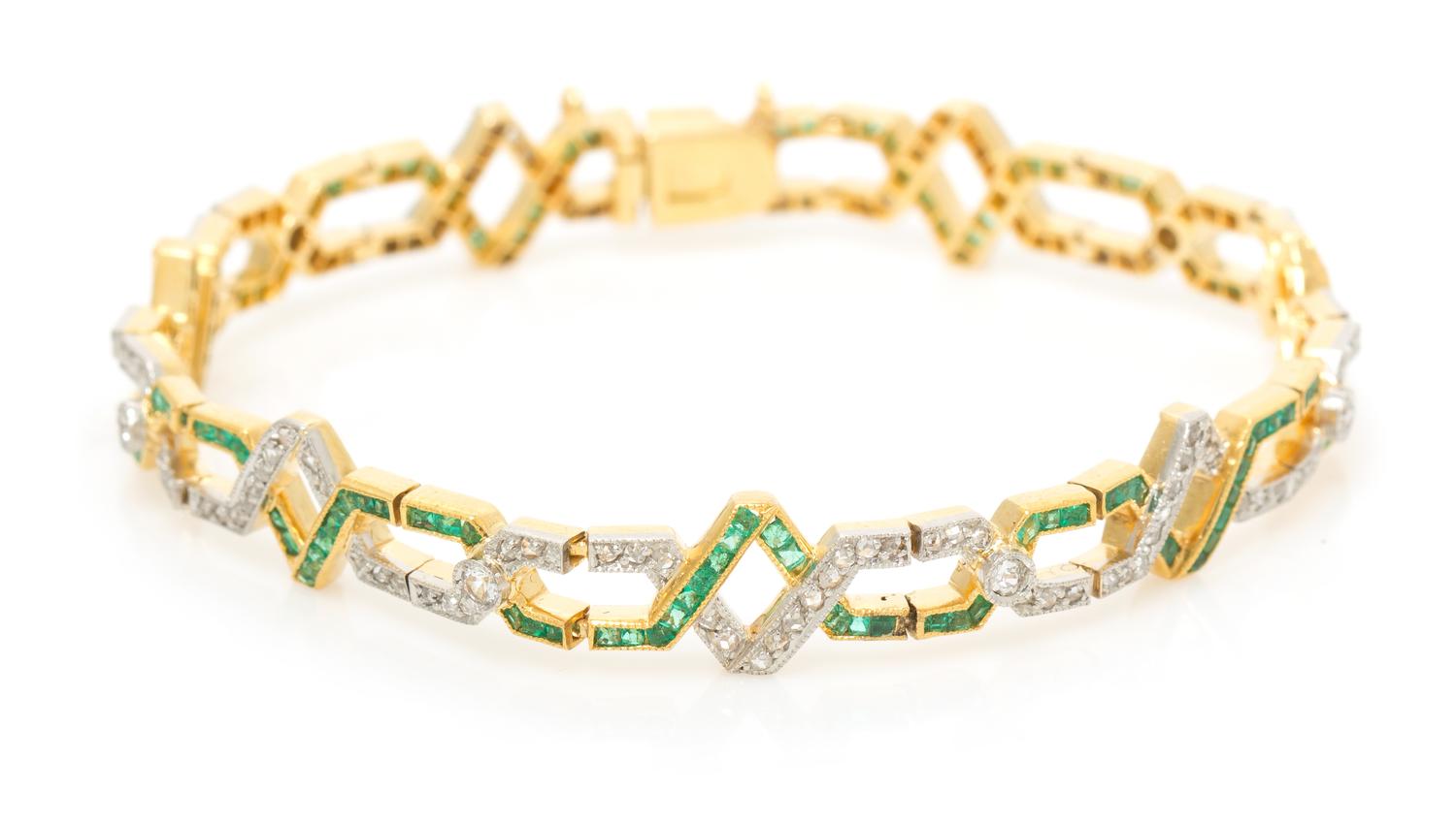 A Platinum Topped Gold, Diamond and Emerald Bracelet, 11.50 dwts.