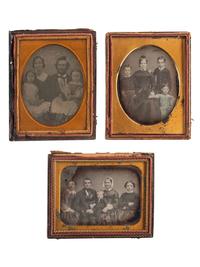 [EARLY PHOTOGRAPHY]. A charming collection of 6 family portrait daguerreotypes and one ambrotype, including: