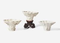 Three Chinese Dehua Porcelain Libation Cups and a Wood Stand