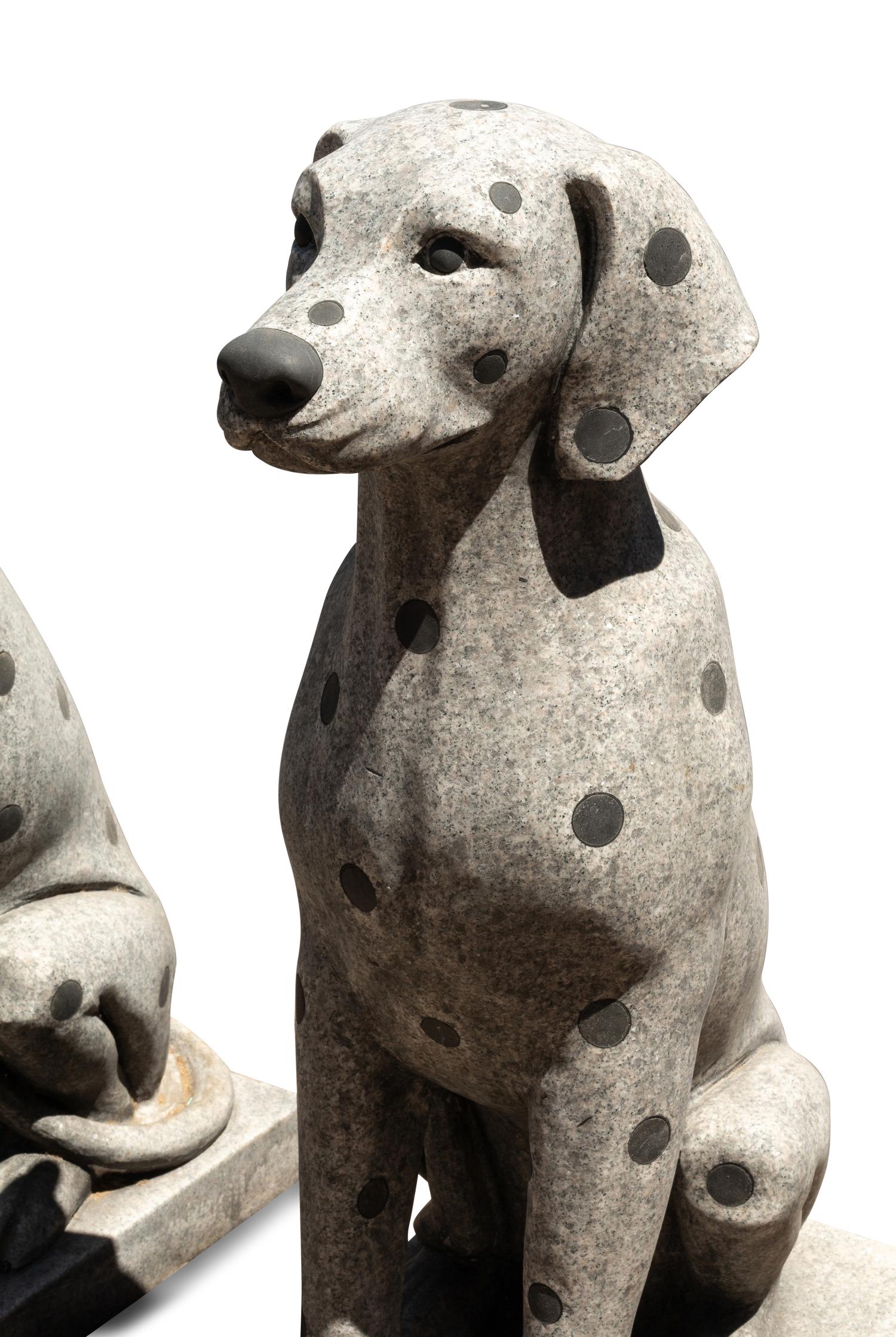 A Pair of Carved Granite and Black Marble Inlaid Seated Dogs