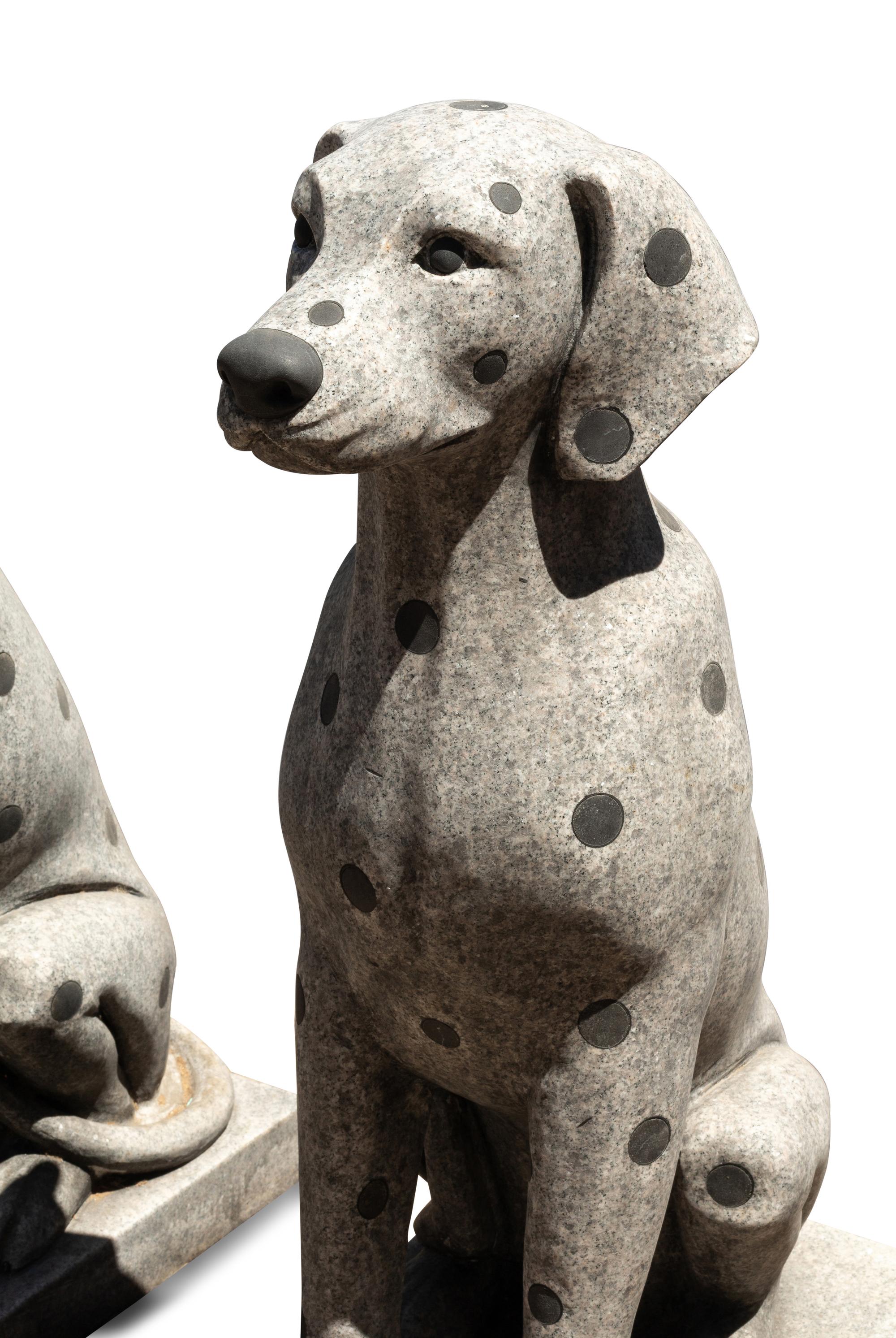A Pair of Carved Granite and Black Marble Inlaid Seated Dogs
