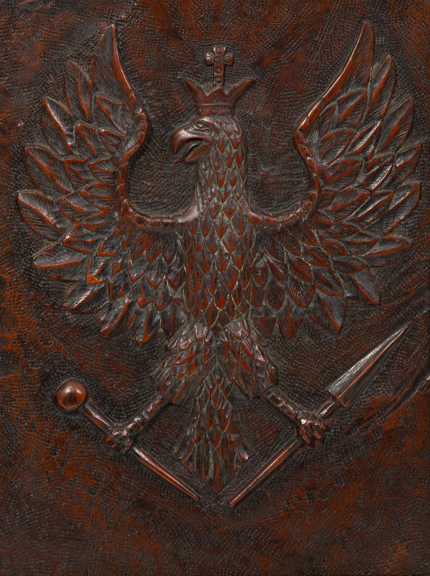 A Continental Carved Wood Panel of Spread Winged Crowned Eagle