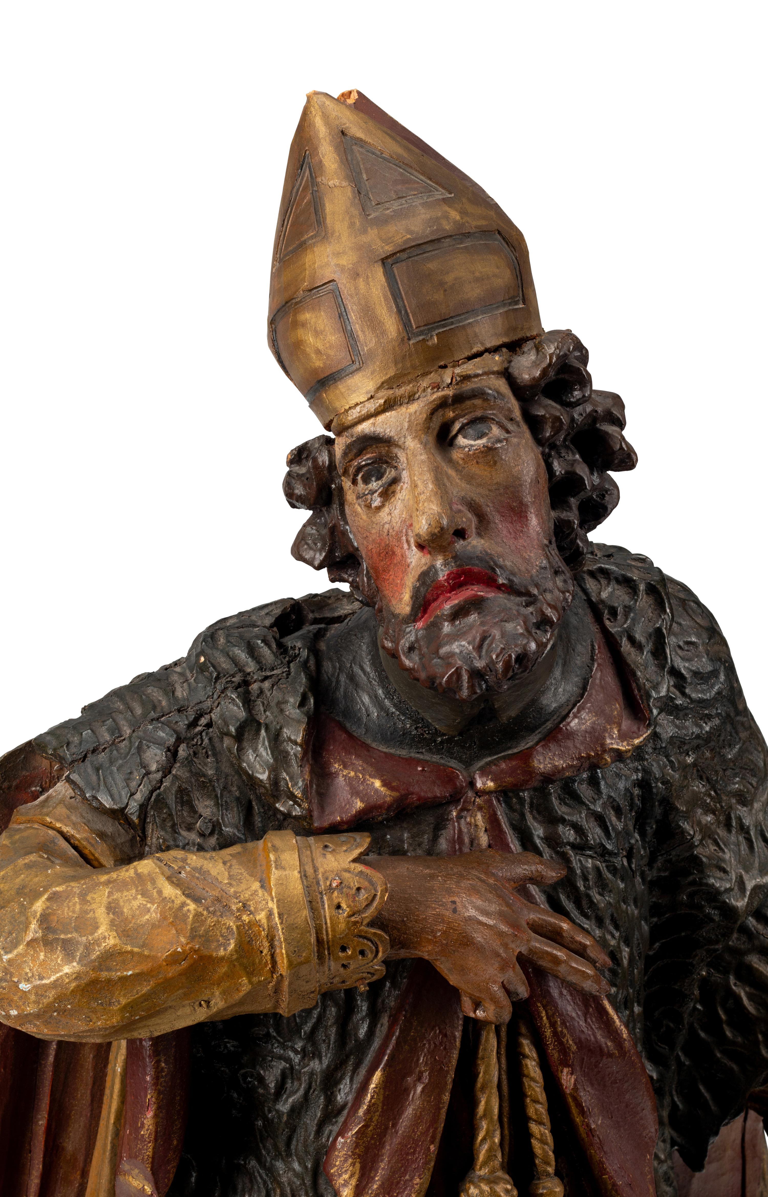 An Italian Carved and Painted Saint Figure and Stand