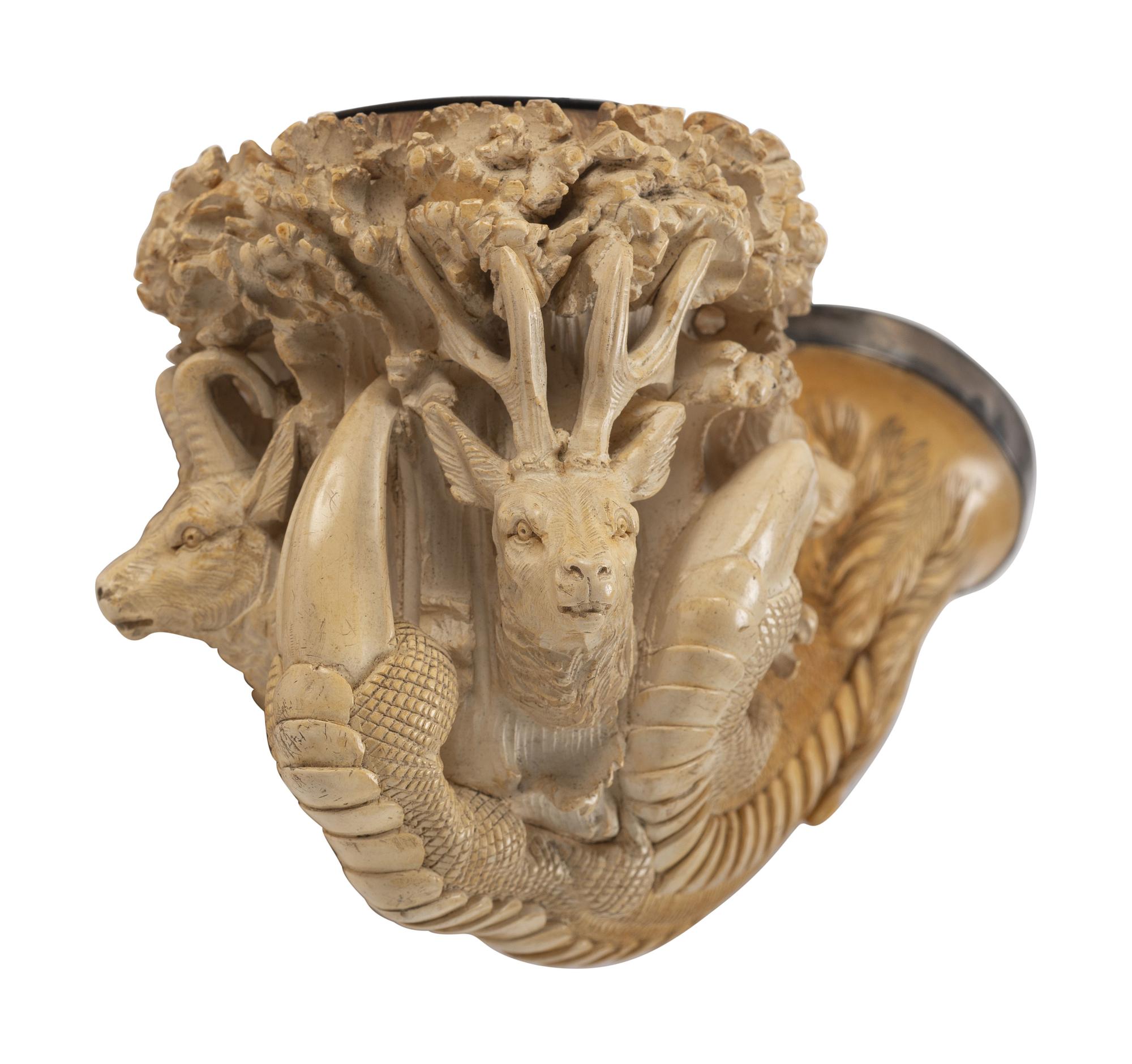 [AMERICANA - PIPES]. 2 ornately carved meerschaum pipes, each featuring animal motifs.
