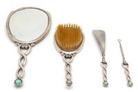An Art Deco Silver Vanity Set, International Silver Co., New Jersey, 20th Century, with enamel and dolphin form mother-of-pearl inlay;