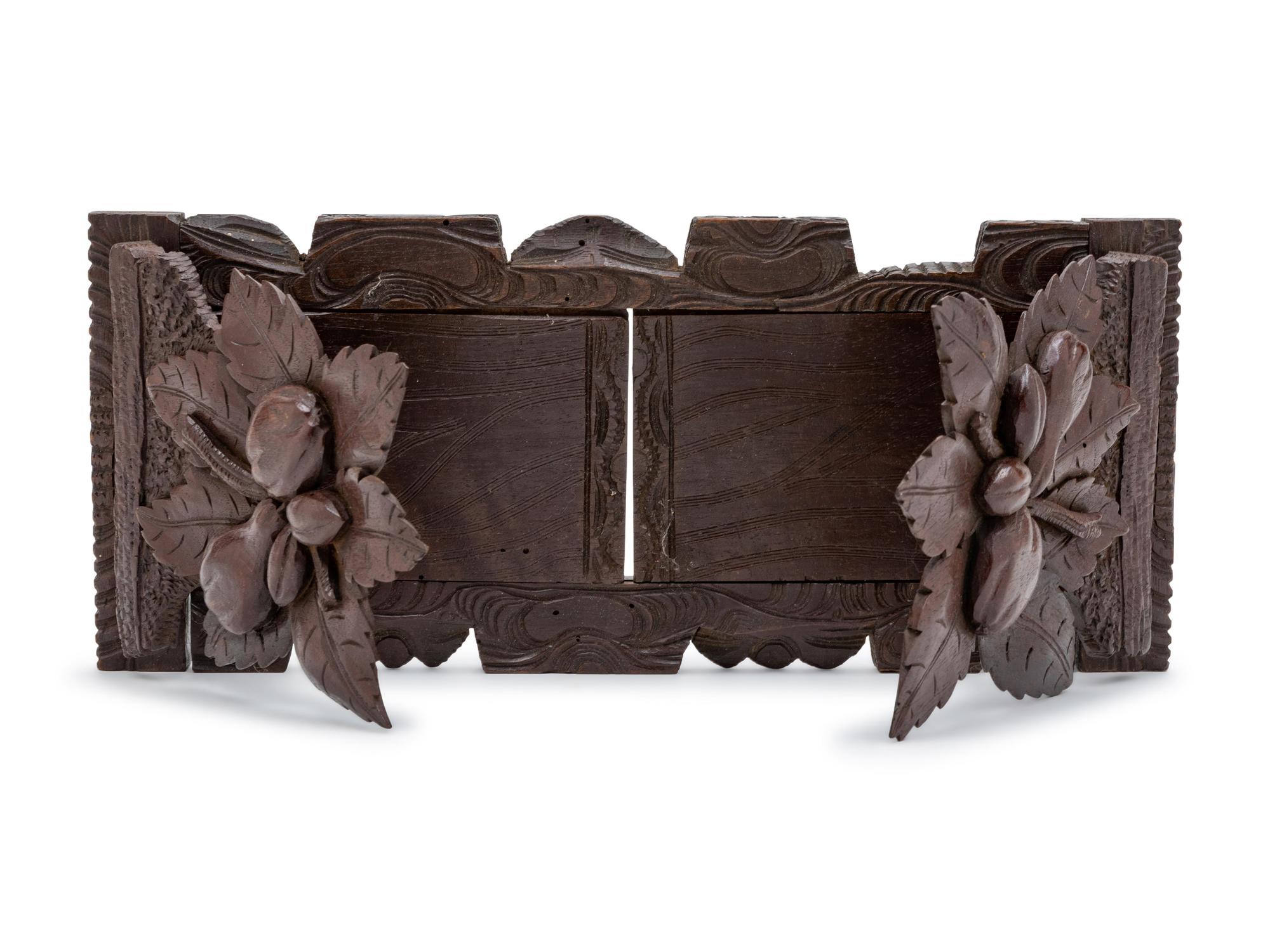 A Black Forest Carved Oak Book Slide