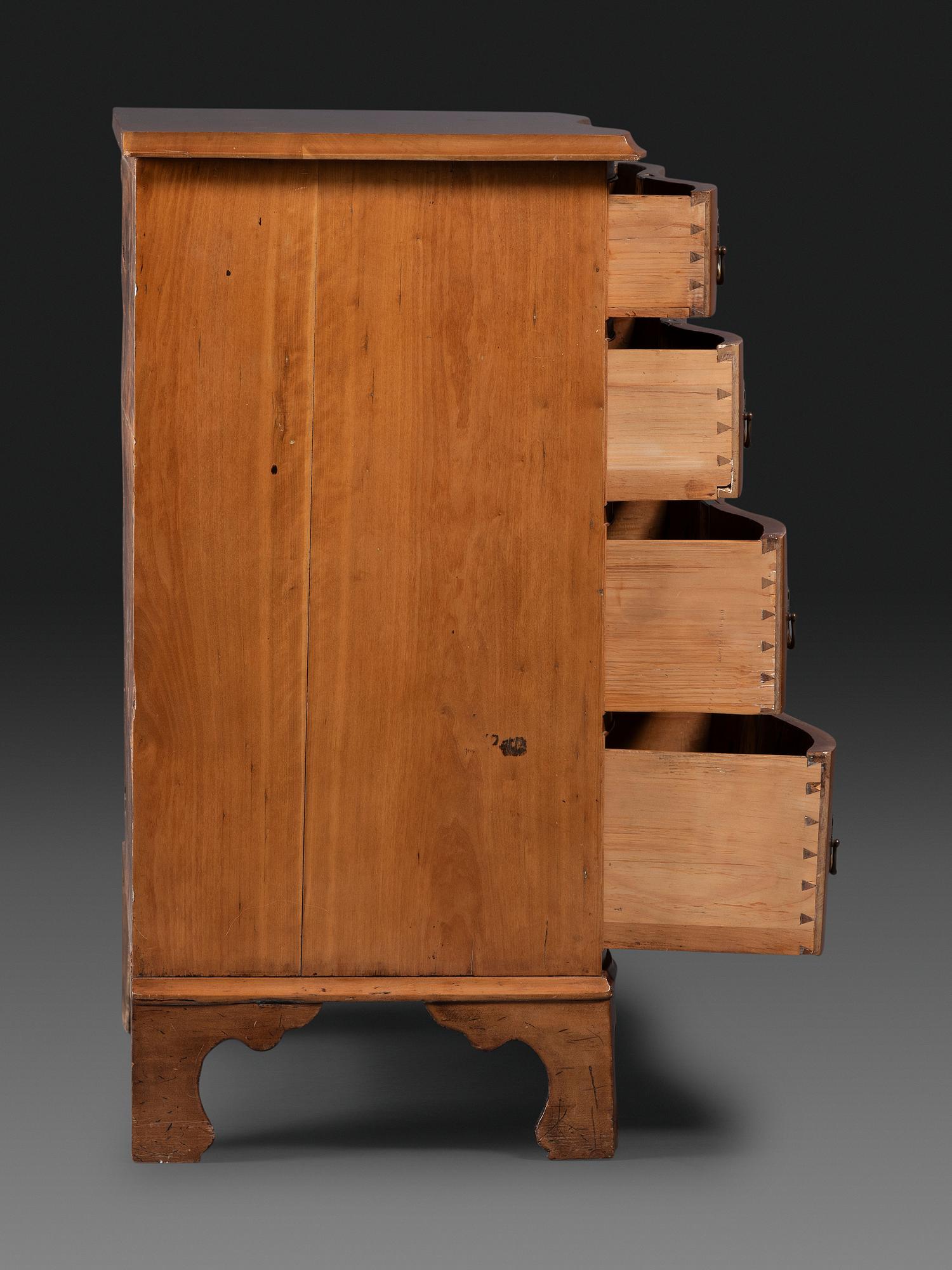 A Chippendale Cherrywood Reverse-Serpentine Chest of Drawers