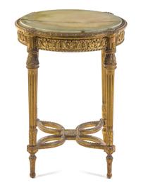 A Louis XVI Style Giltwood Gueridon Height 29 1/2 x depth 24 inches.