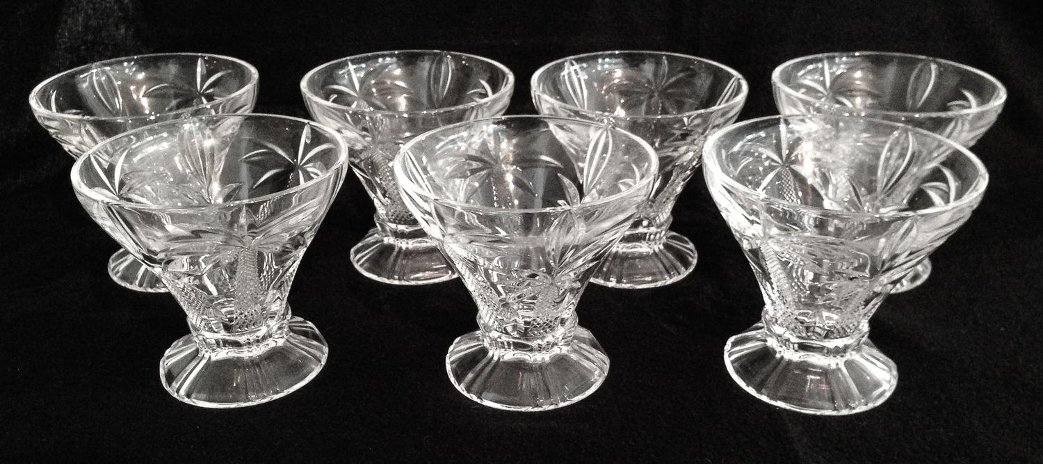 Twelve Molded Glass Sherbet Glasses Height 4 1/4 inches.