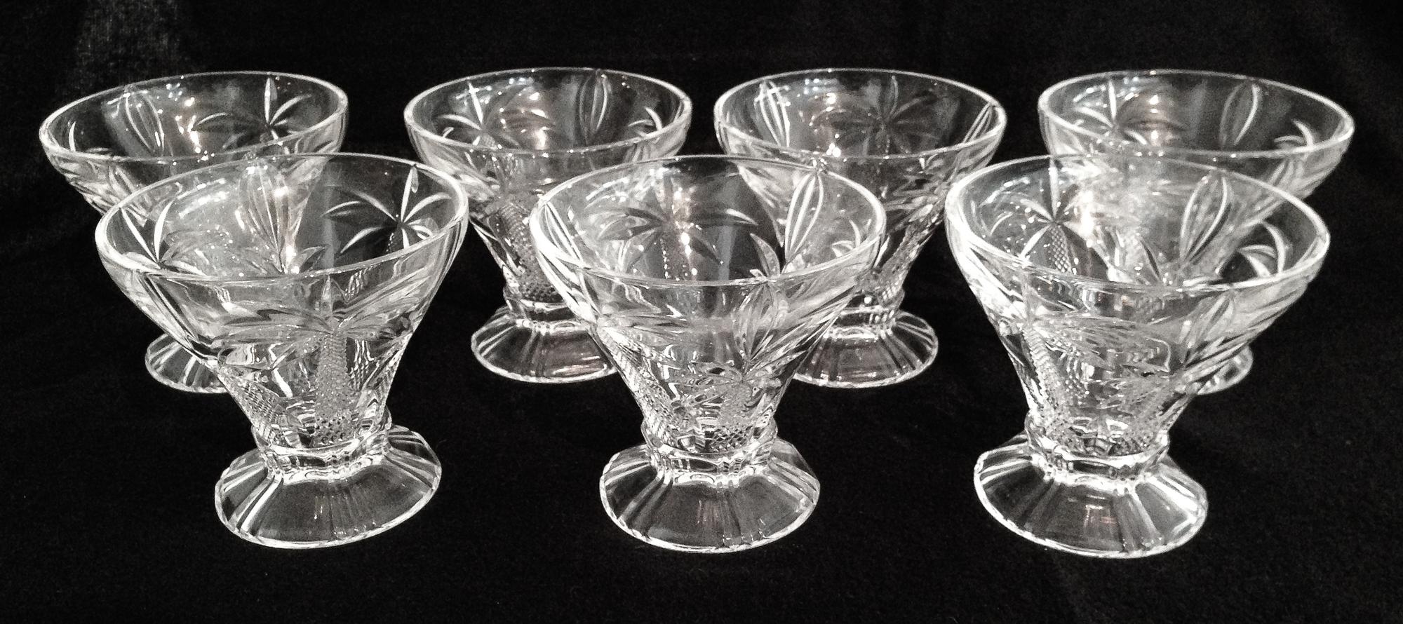 Twelve Molded Glass Sherbet Glasses Height 4 1/4 inches.