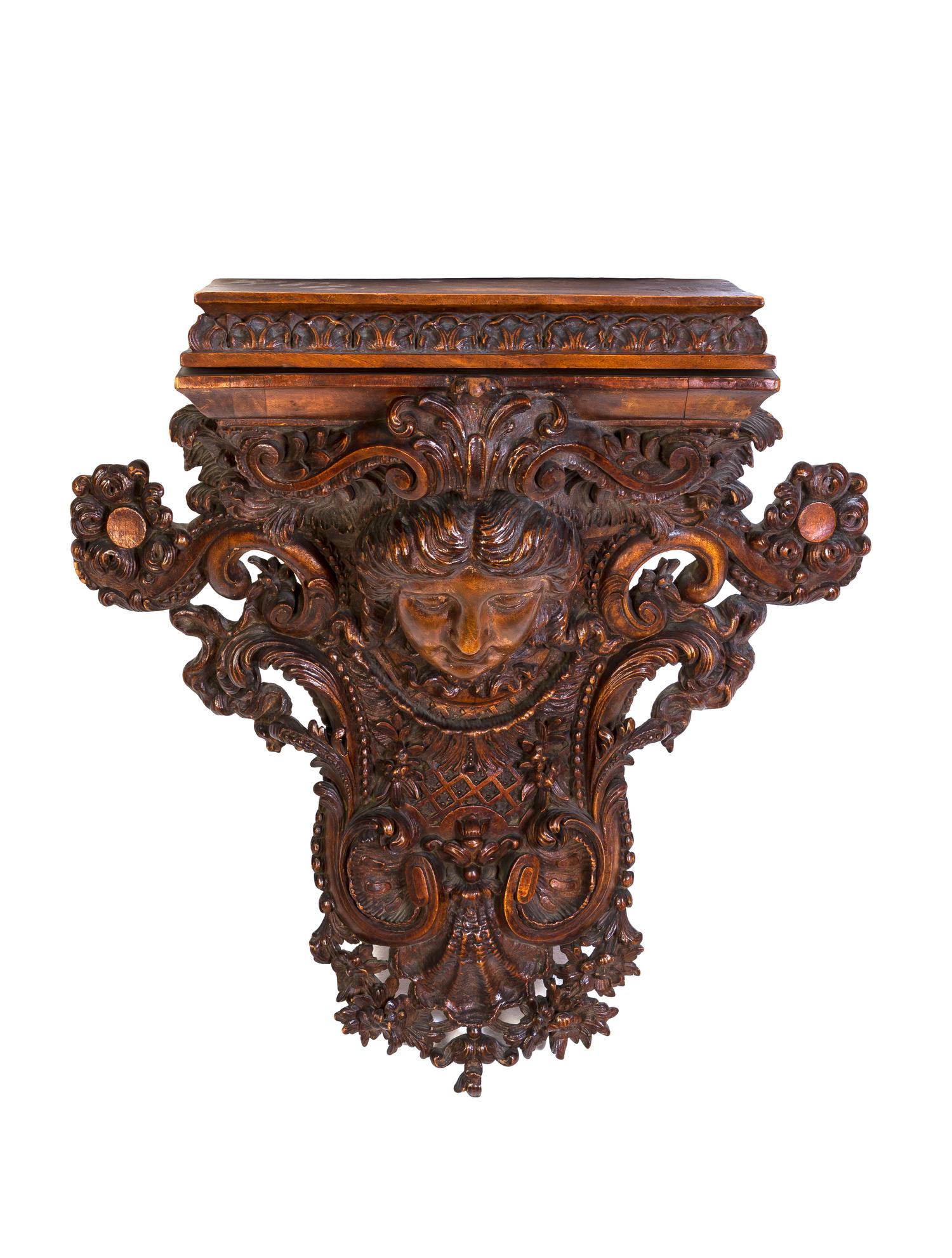A Neoclassical Carved Oak Bracket, Height 21 inches.