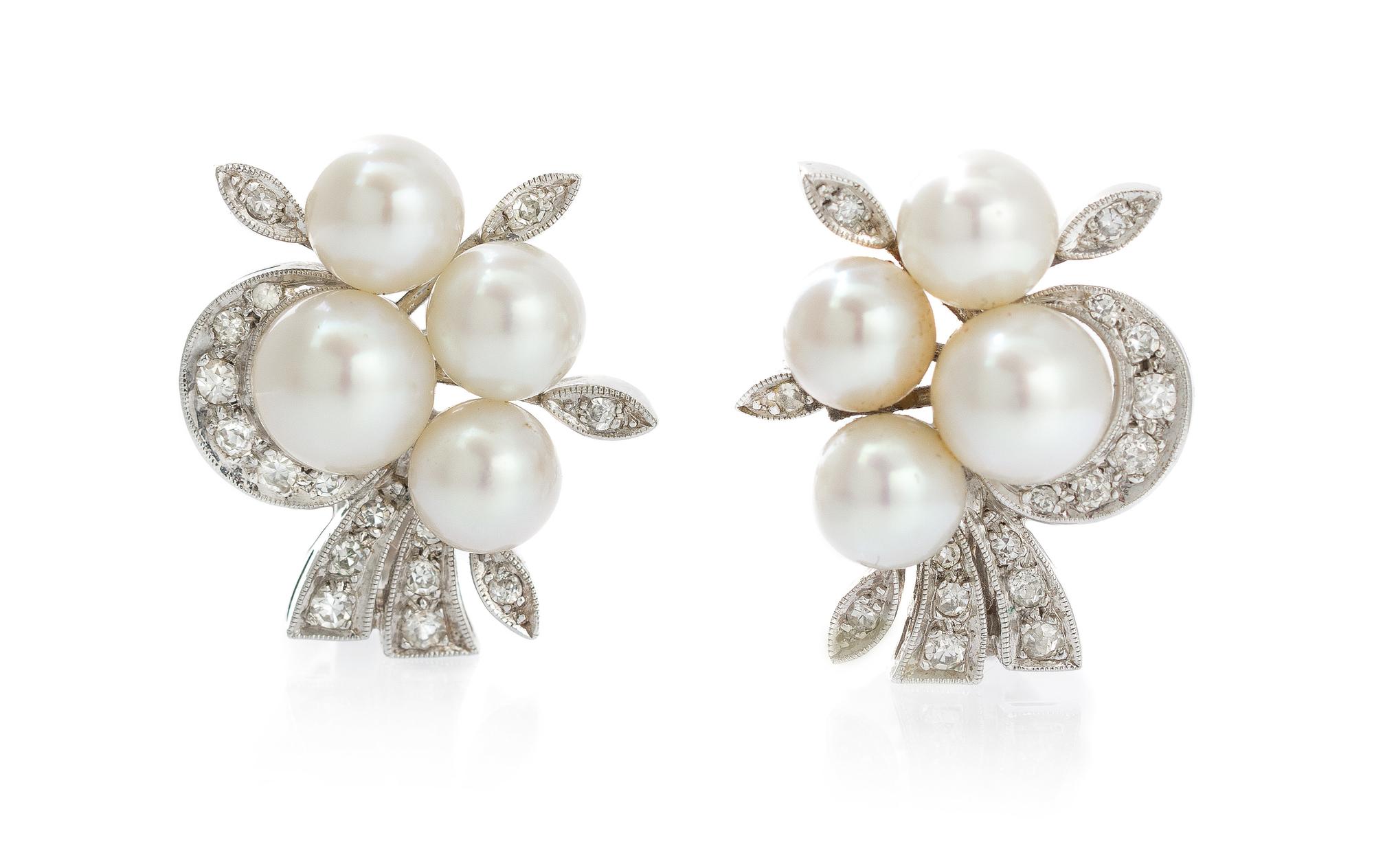 A Pair of White Gold, Diamond and Pearl Earclips, 7.80 dwts.