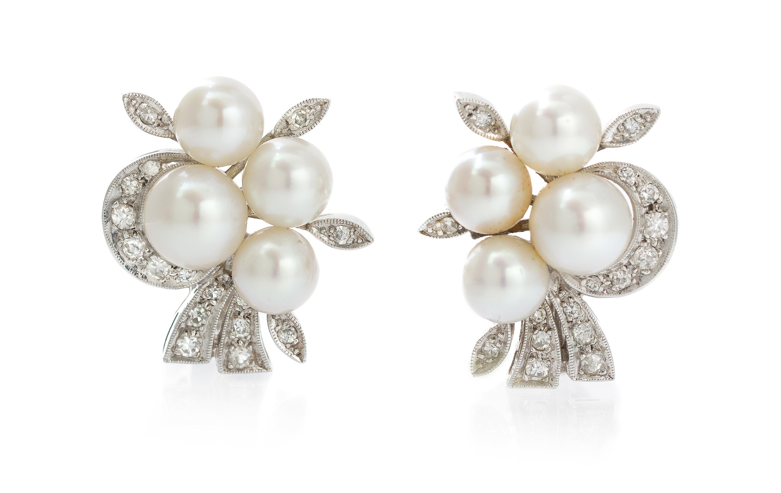 A Pair of White Gold, Diamond and Pearl Earclips, 7.80 dwts.