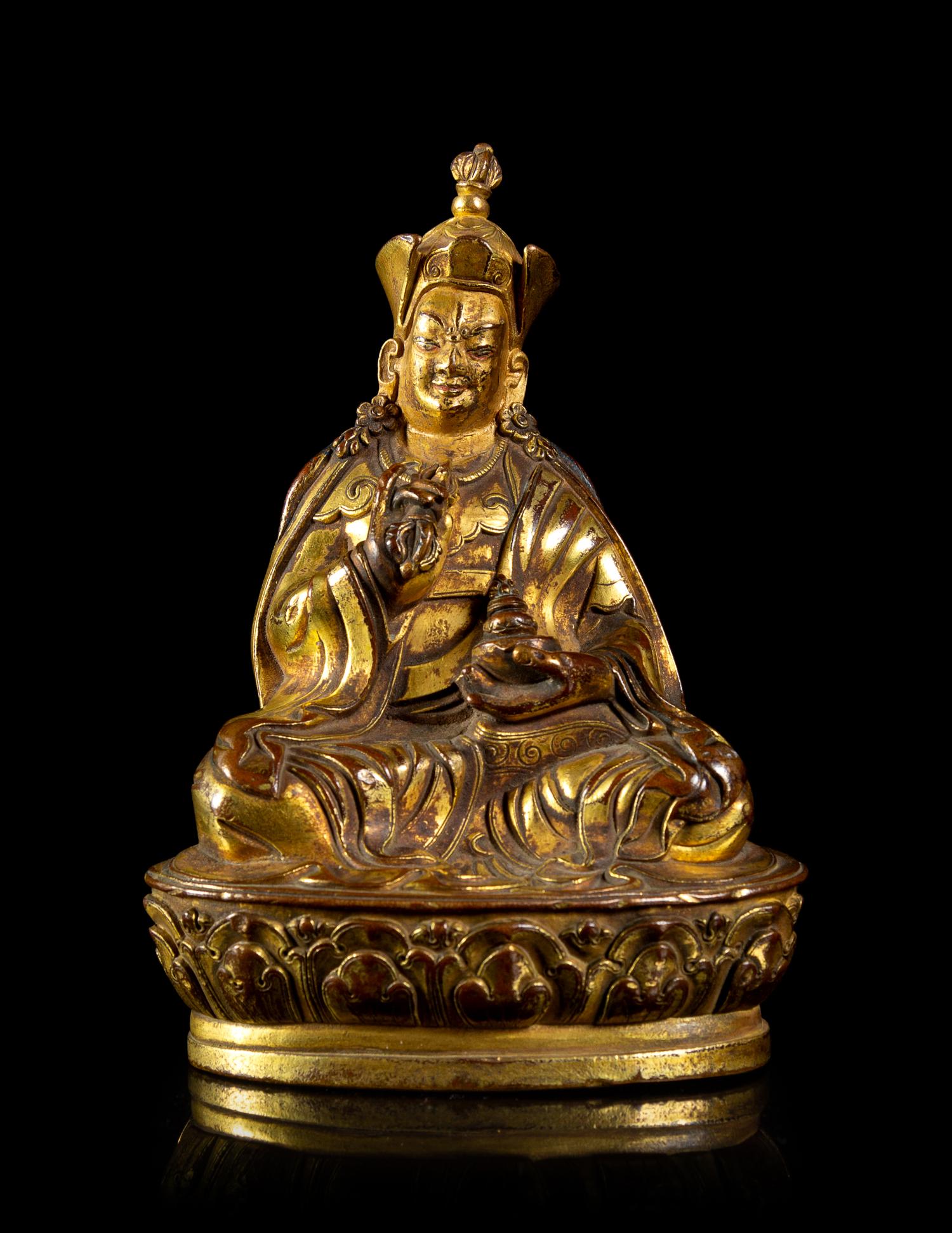 A Small Sino-Tibetan Gilt Bronze Figure of Penchen Lama