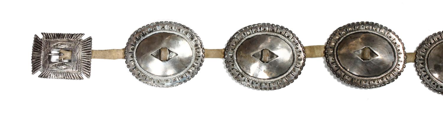 A Navajo First Phase Concho Belt Length overall 33 inches; concho 4 x 3 1/2; buckle 3 7/8 x 3 1/8 inches. — LATE 19TH/EARLY 20TH CENTURY