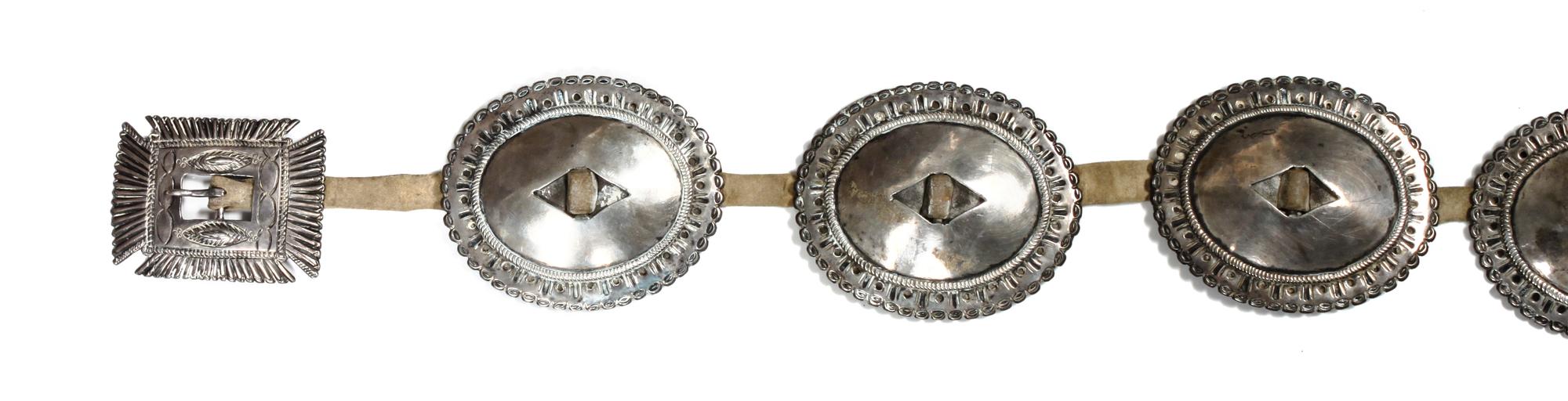 A Navajo First Phase Concho Belt Length overall 33 inches; concho 4 x 3 1/2; buckle 3 7/8 x 3 1/8 inches. — LATE 19TH/EARLY 20TH CENTURY