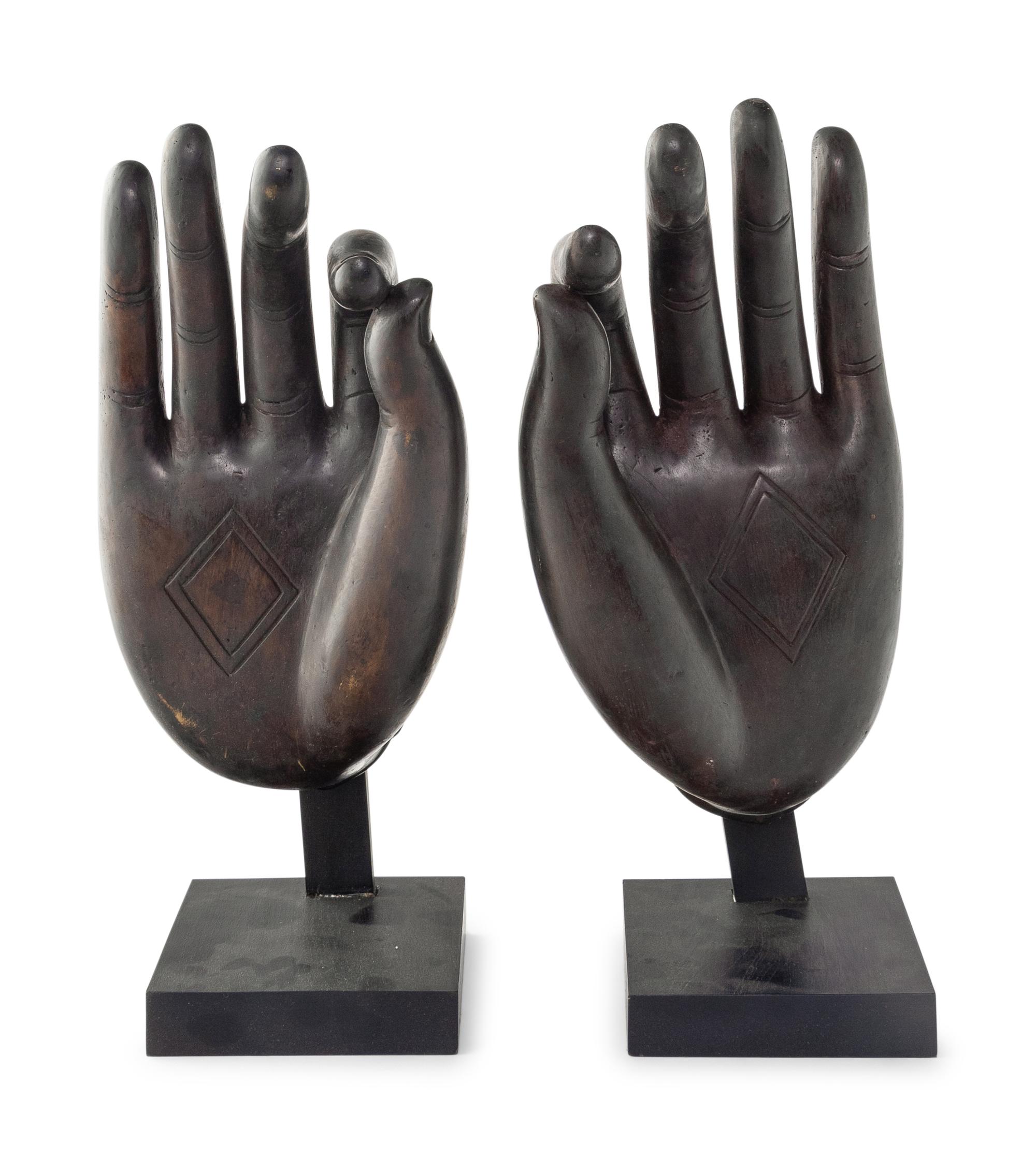 A Large Pair of Chinese Lacquered Bronze Buddha Hands